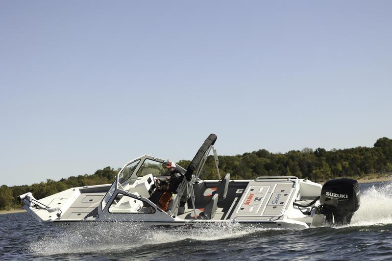 2026 SeaArk Dynasty 2.0 boat cruising on a lake with Suzuki outboard motor.