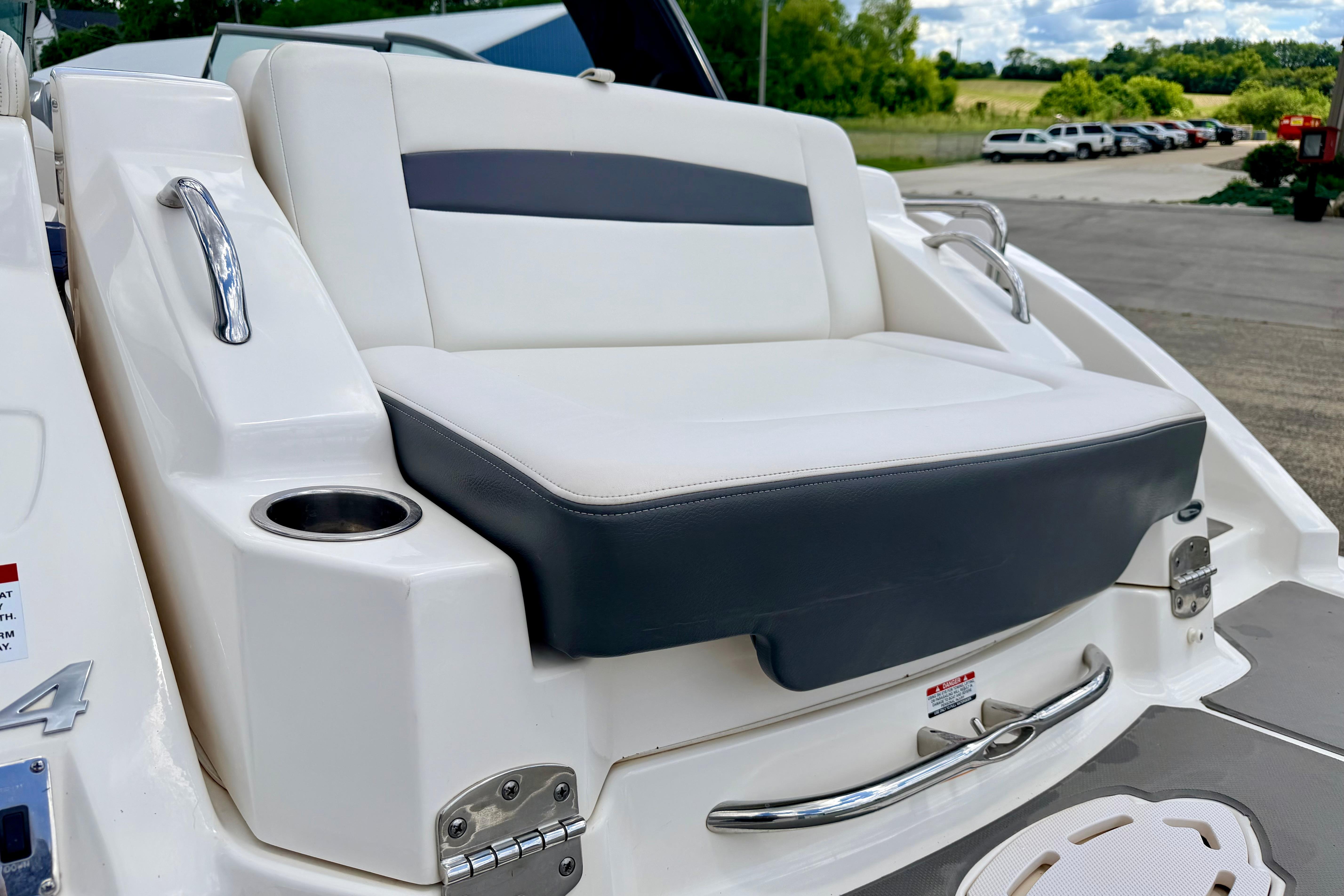 2015 Chaparral Sunesta 264 boat seat with cup holder and sleek design.