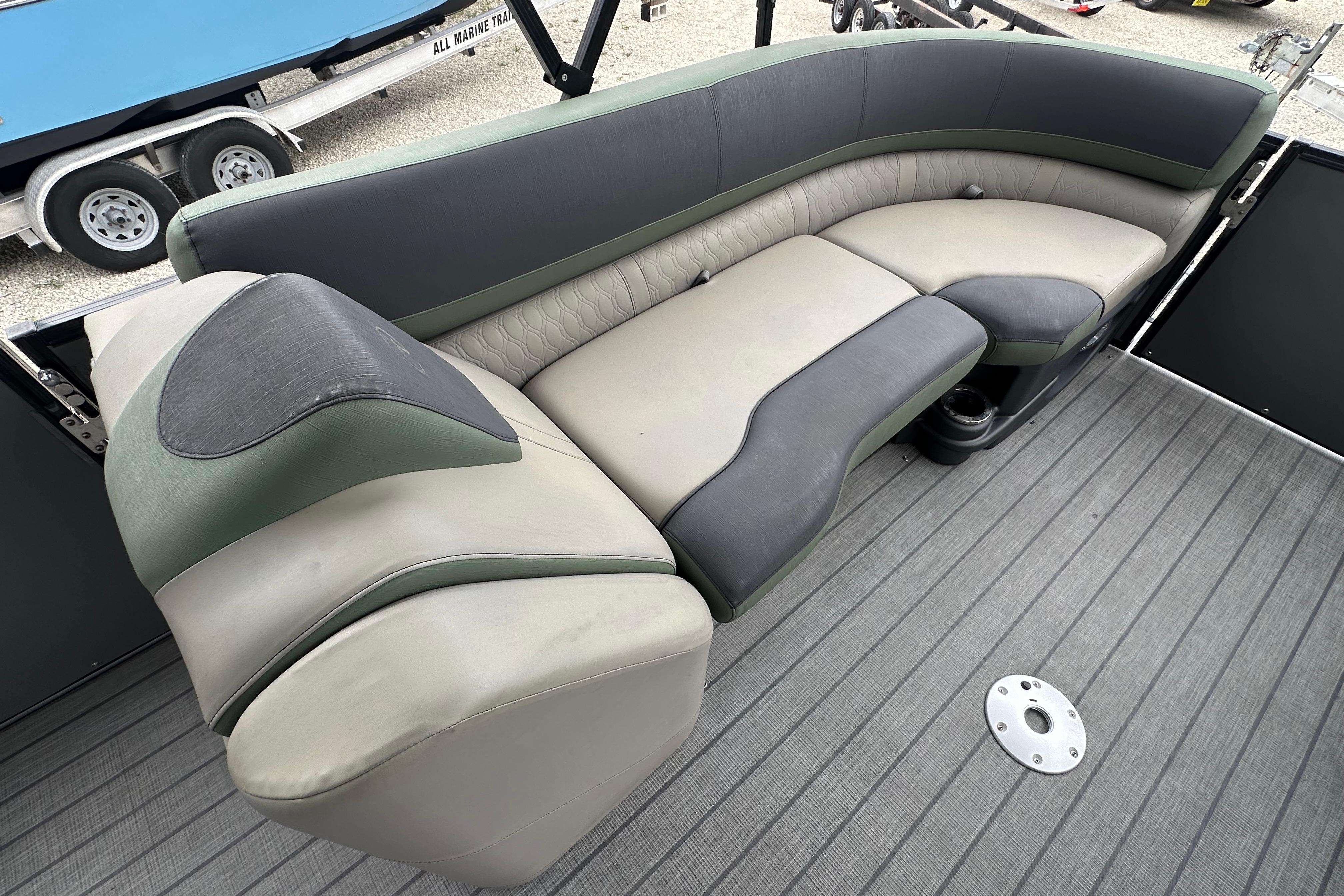 2023 Avalon Catalina Quad Lounge boat seating, featuring plush, curved upholstery and modern design.
