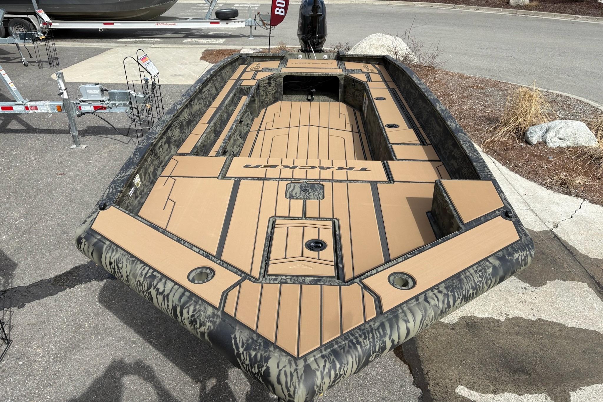 2026 Tracker Grizzly 1756 T Marsh boat with camouflage design and spacious deck layout.