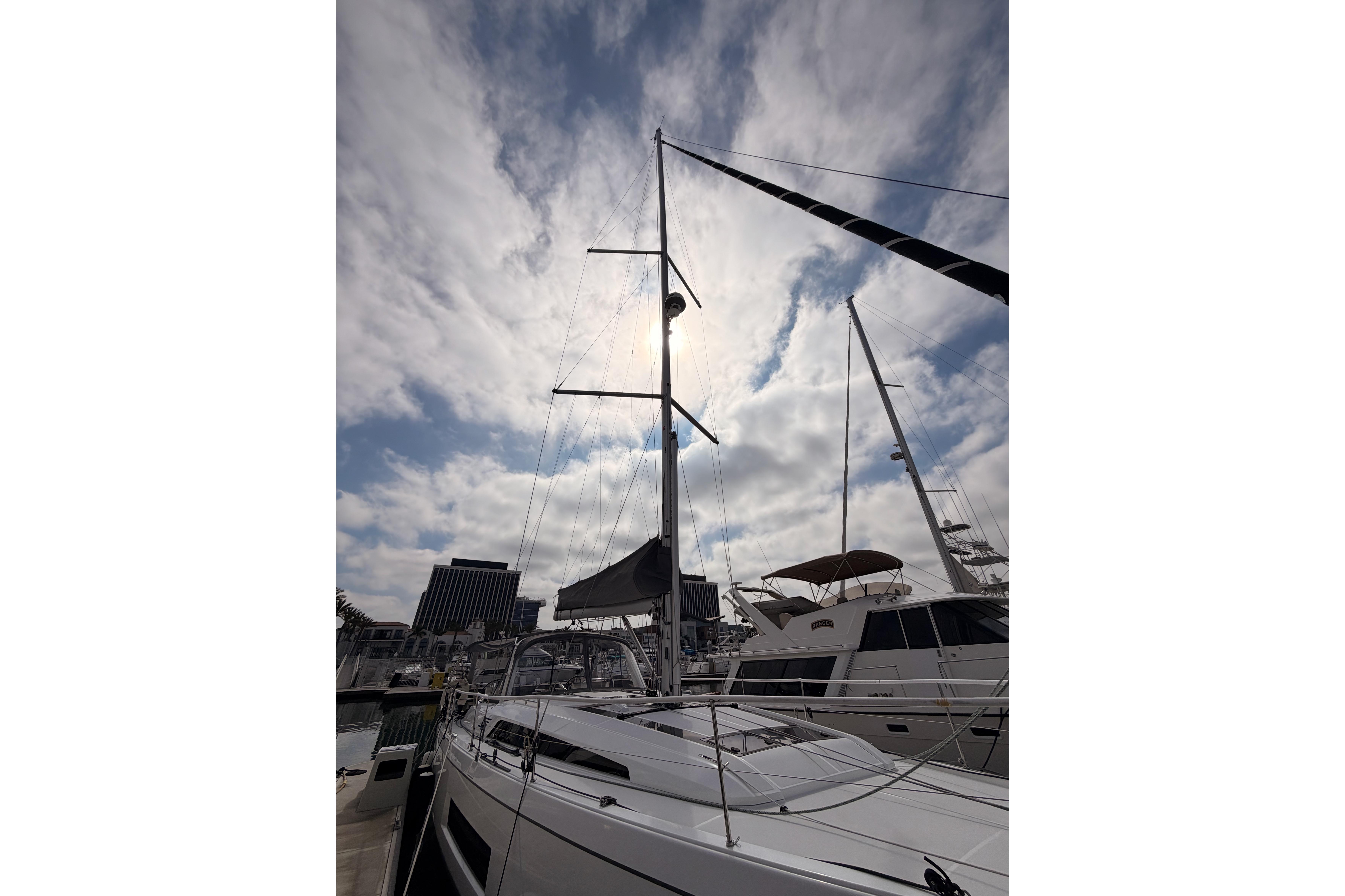 2020 Beneteau Oceanis 46.1 sailboat docked under a cloudy sky.