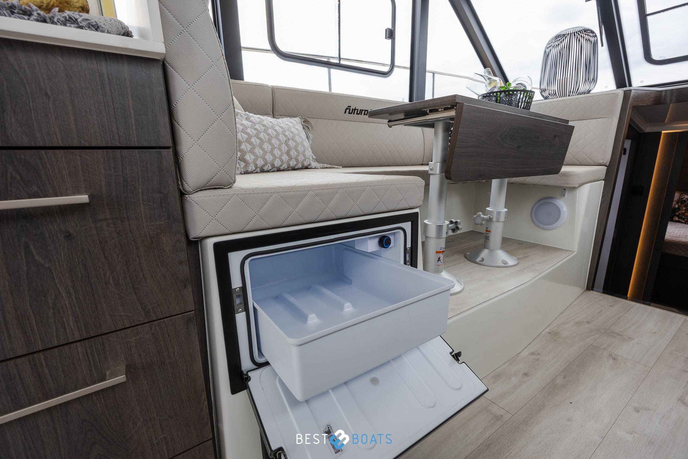 Interior of 2023 Cobra Yachts Futura 36 Premium Fly with open mini fridge.