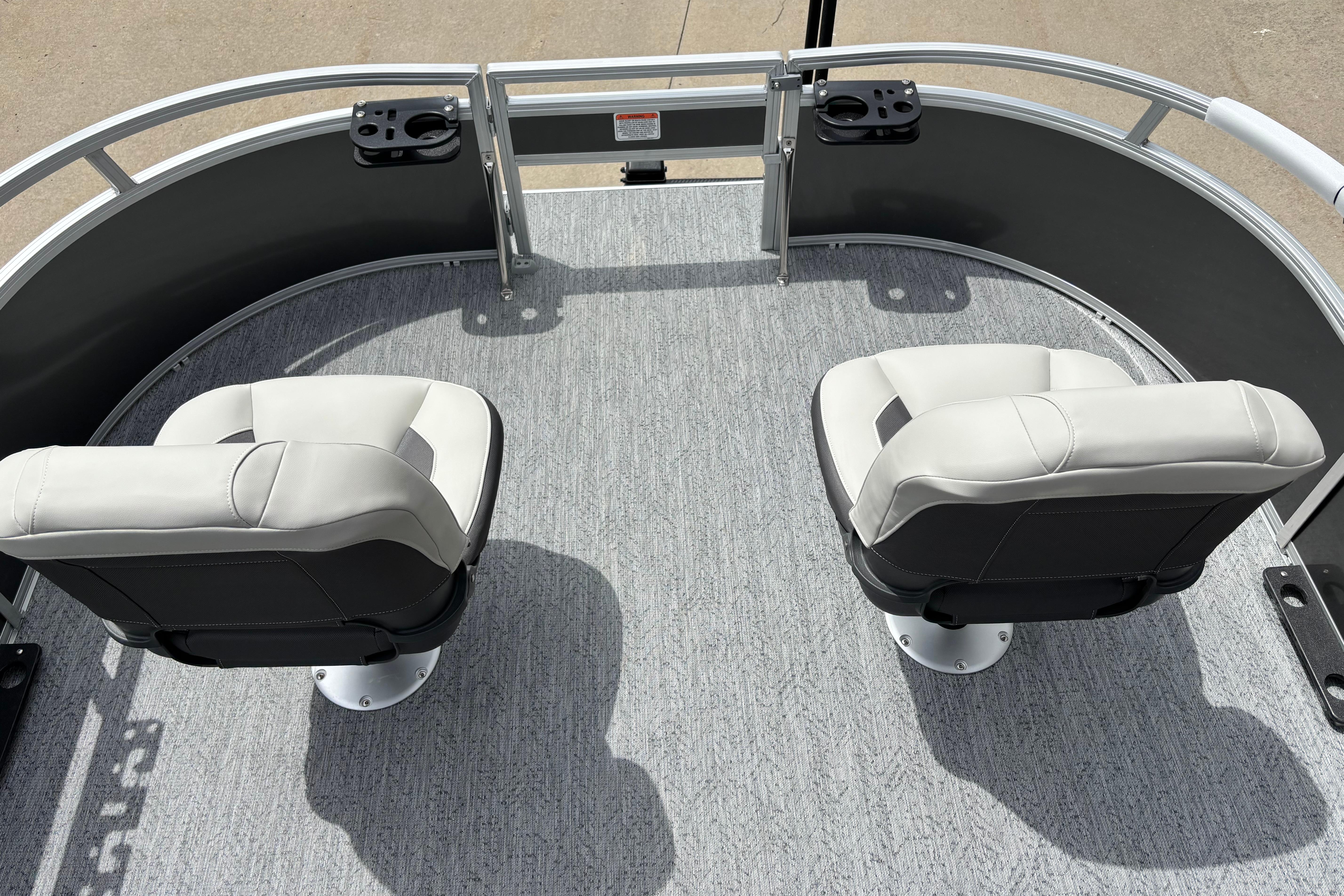 2026 Sun Tracker Bass Buggy 16 XL Select boat with two swivel seats on deck.