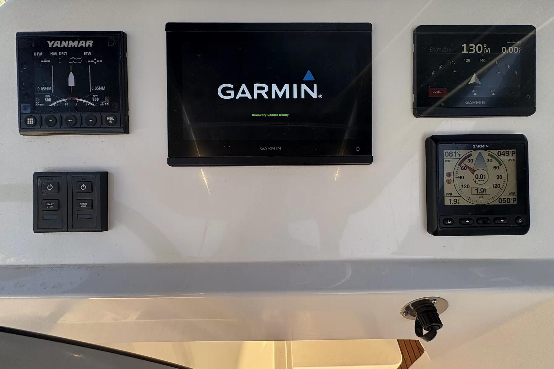 Control panel of 2024 Aventura 45 yacht featuring Garmin navigation systems.