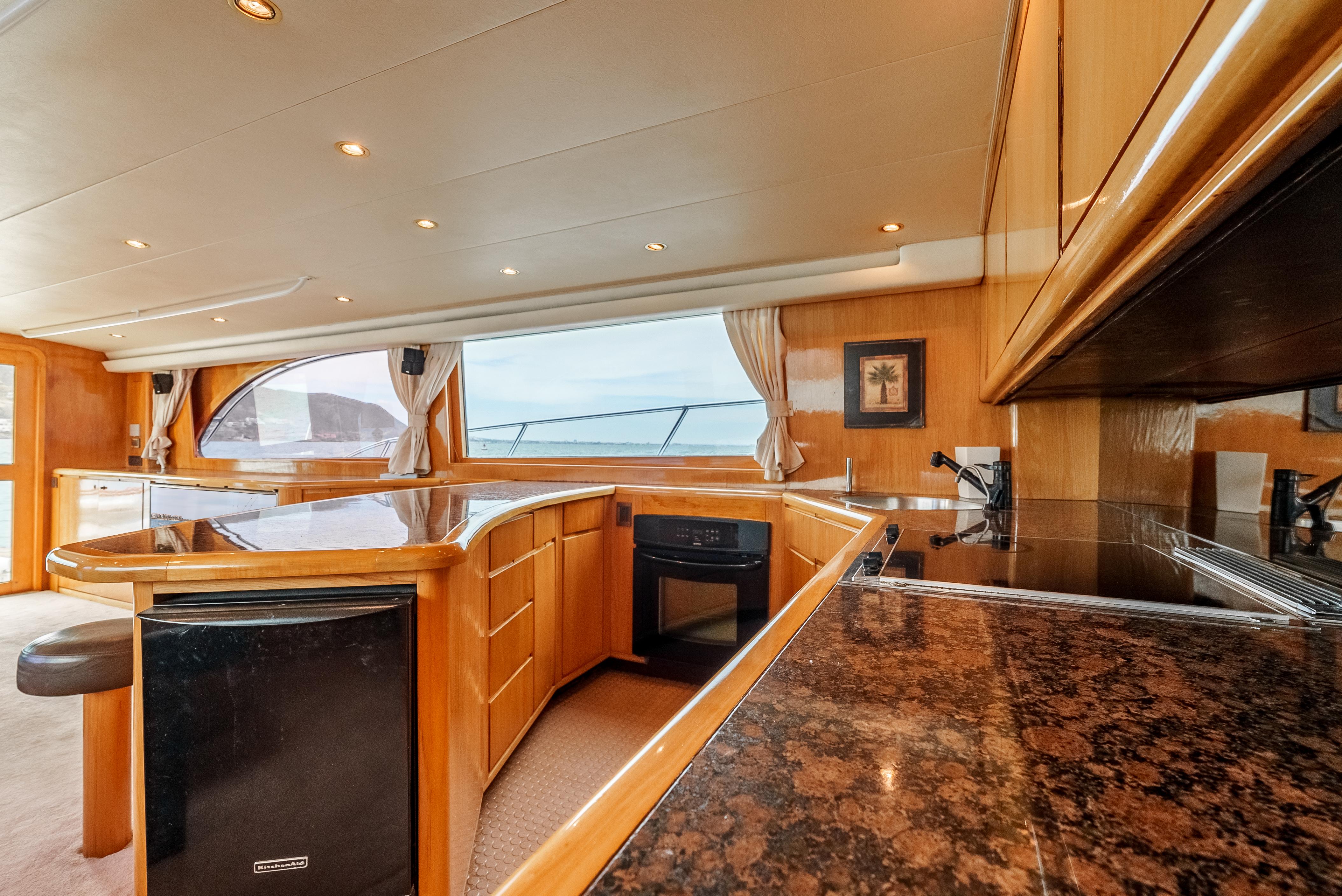Luxurious interior of a 1995 Donzi 72 Convertible yacht with elegant wood finishes.