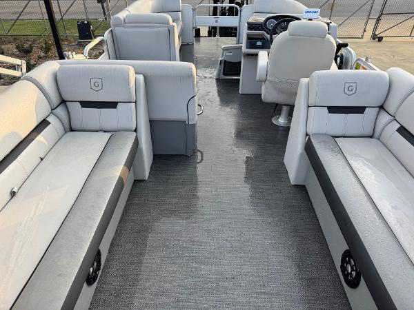 2022 Godfrey 2286 pontoon boat interior with gray seating and steering console.