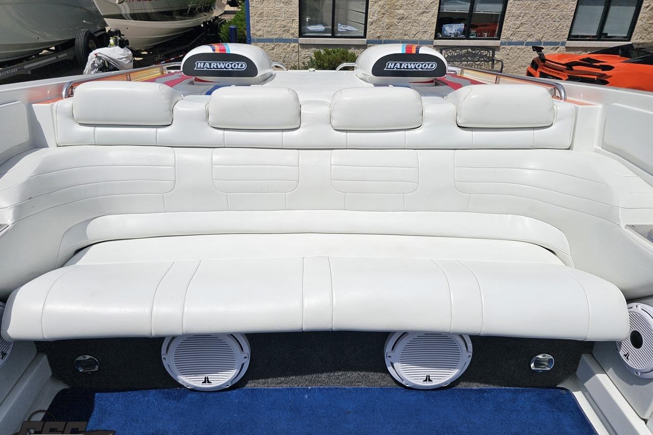 2002 Formula 382 FASTech boat interior with white leather seating and Harwood branding.