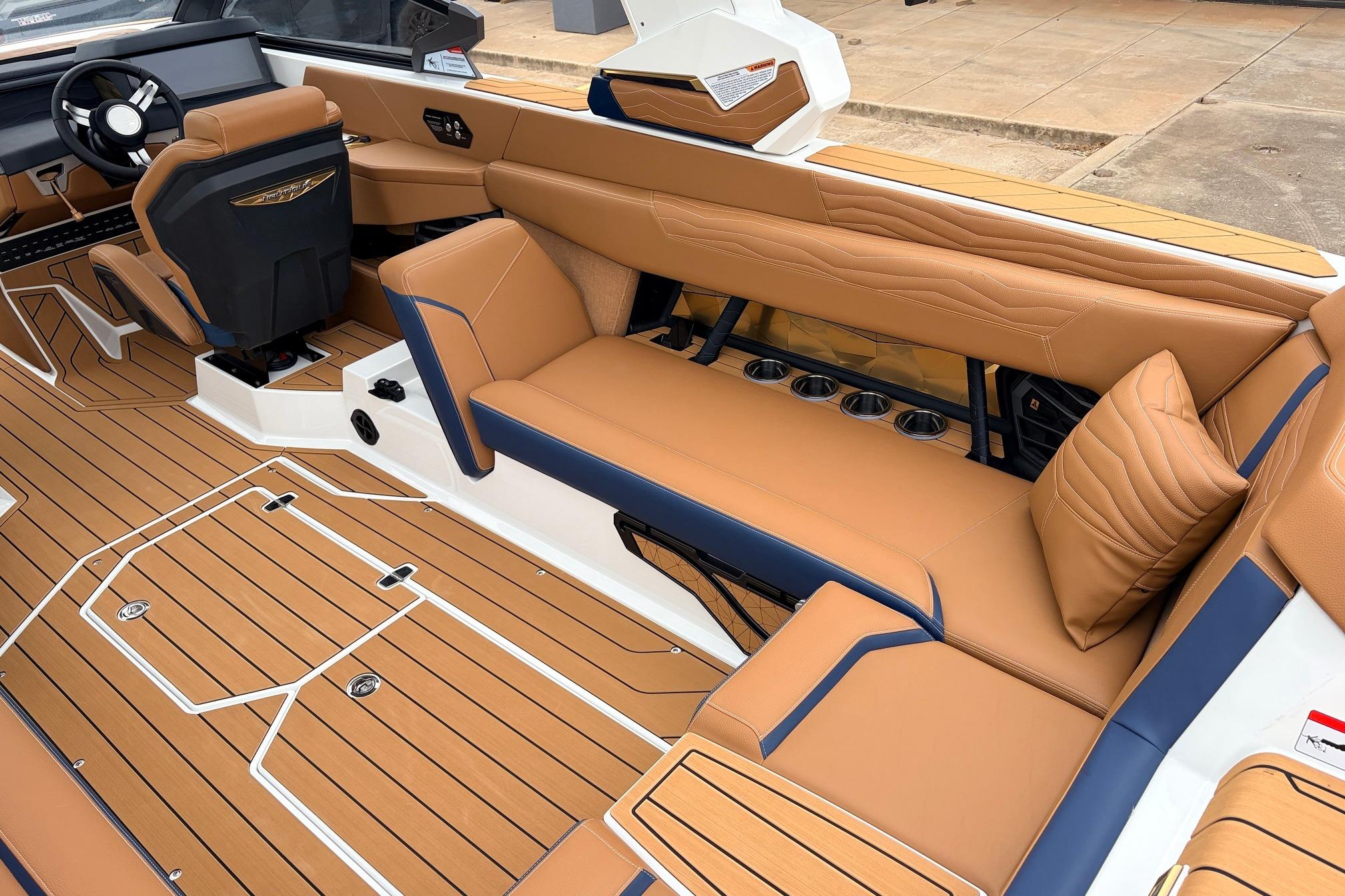 2026 Nautique Super Air Nautique G25 interior with tan leather seating and sleek design.