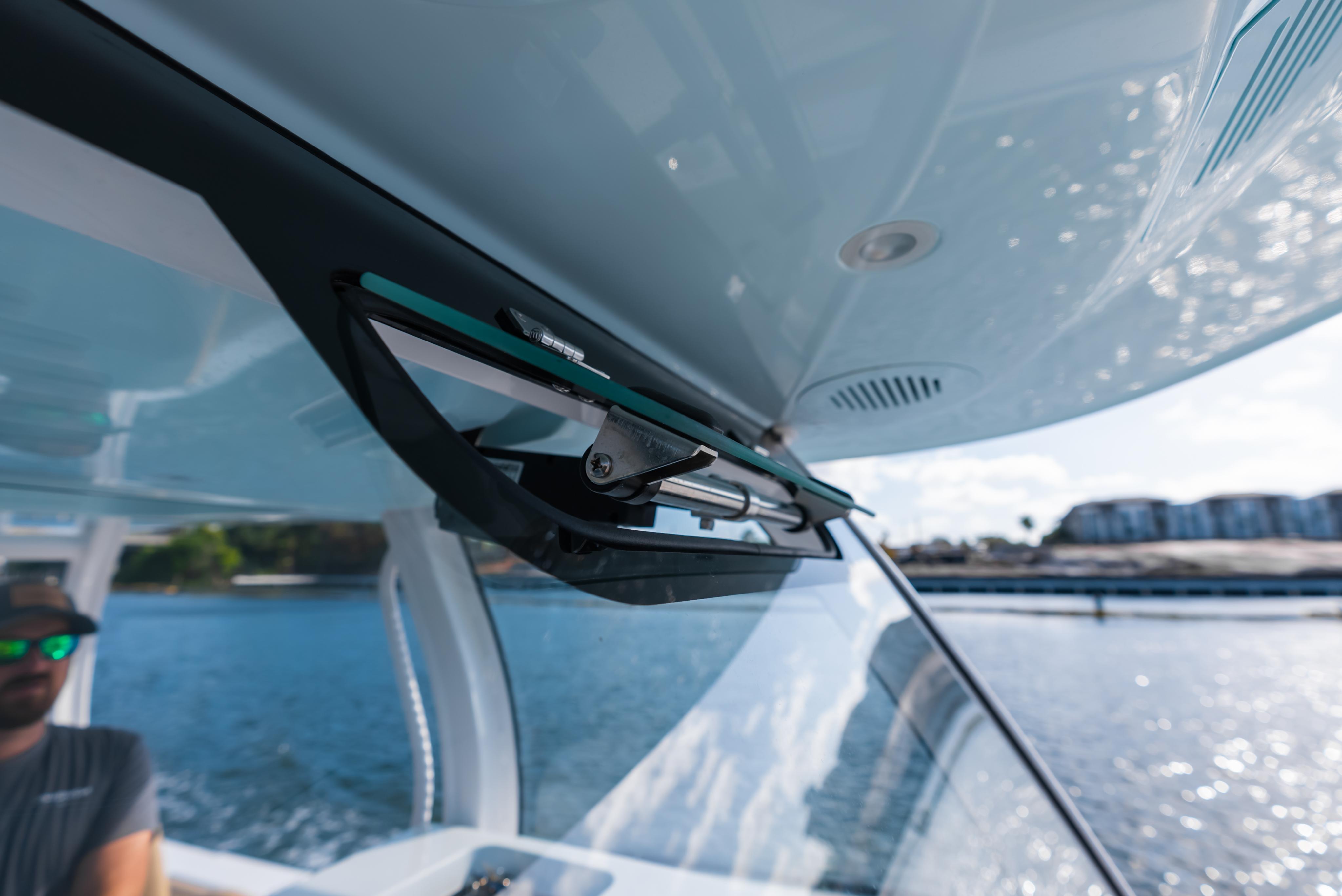 Close-up of 2026 Phenom 34 Center Console boat windshield and wiper system.