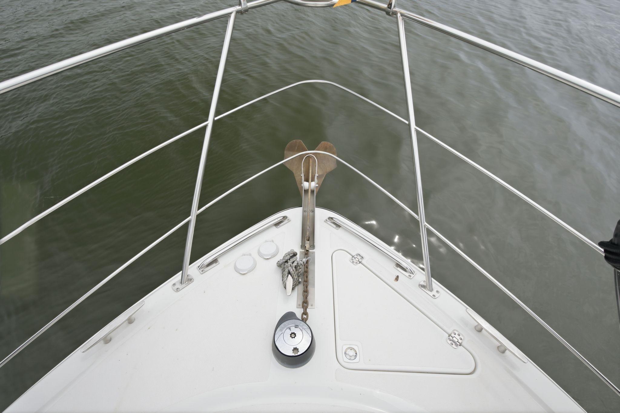 Bow view of 2005 Carver 39 Motor Yacht on calm water.