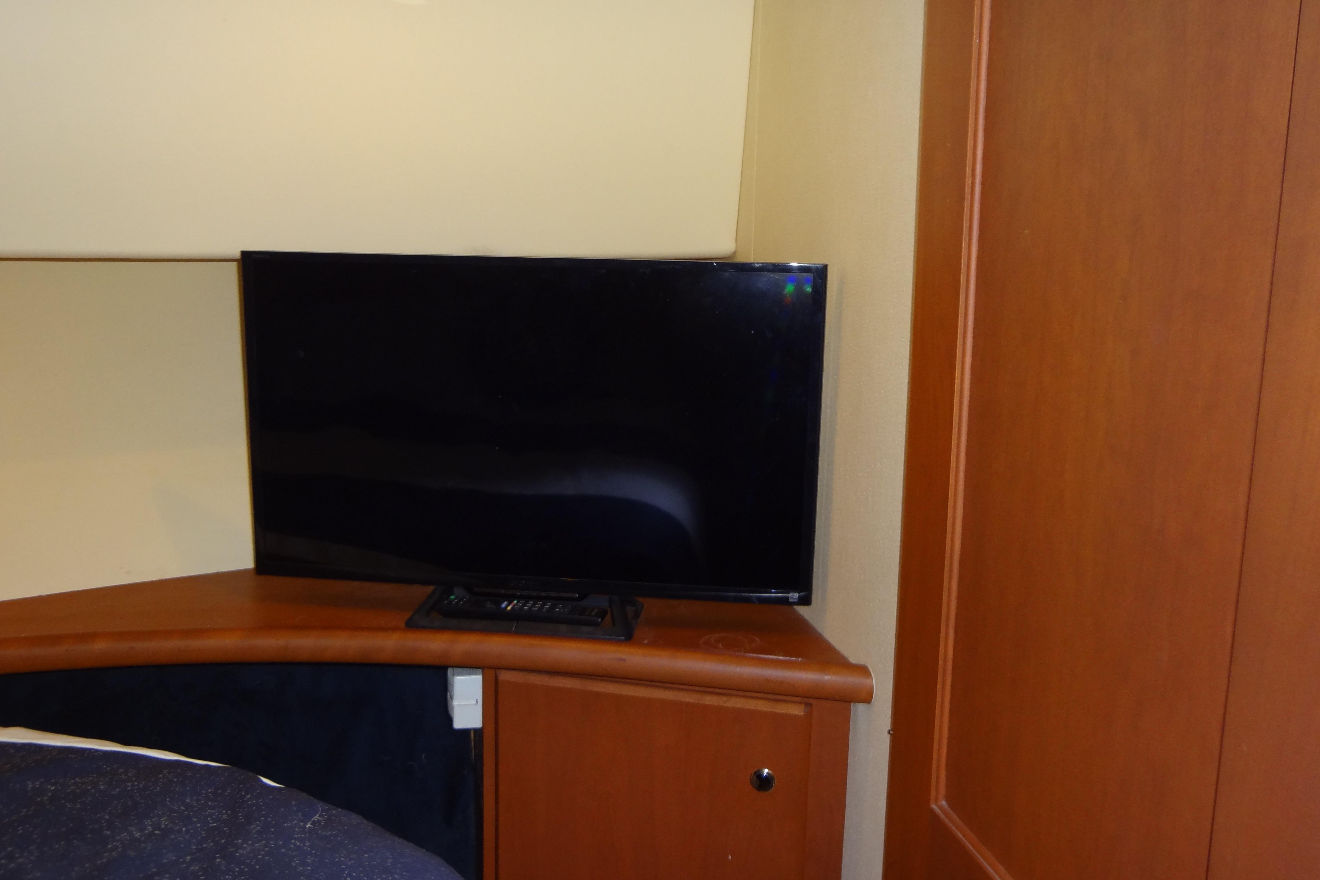 Flat-screen TV in 2005 Silverton 34 Convertible yacht interior.