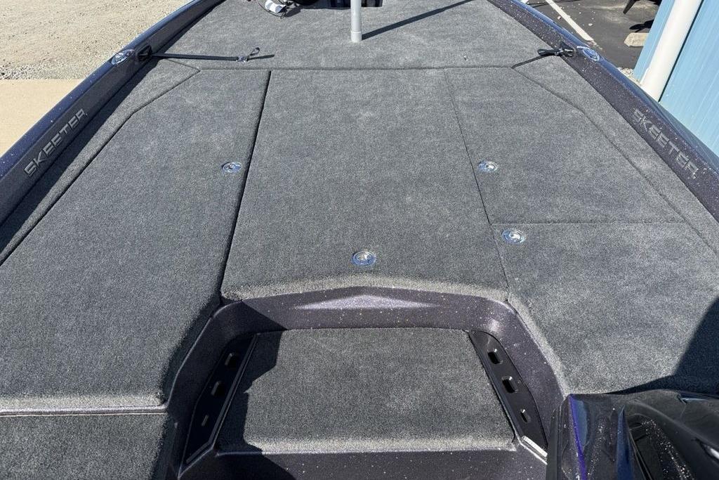 2026 Skeeter ZXE21 boat deck with gray carpet and storage compartments.