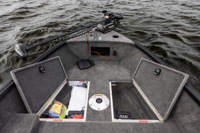 2026 Alumacraft Escape 165 CS boat interior with storage compartments open on a lake.