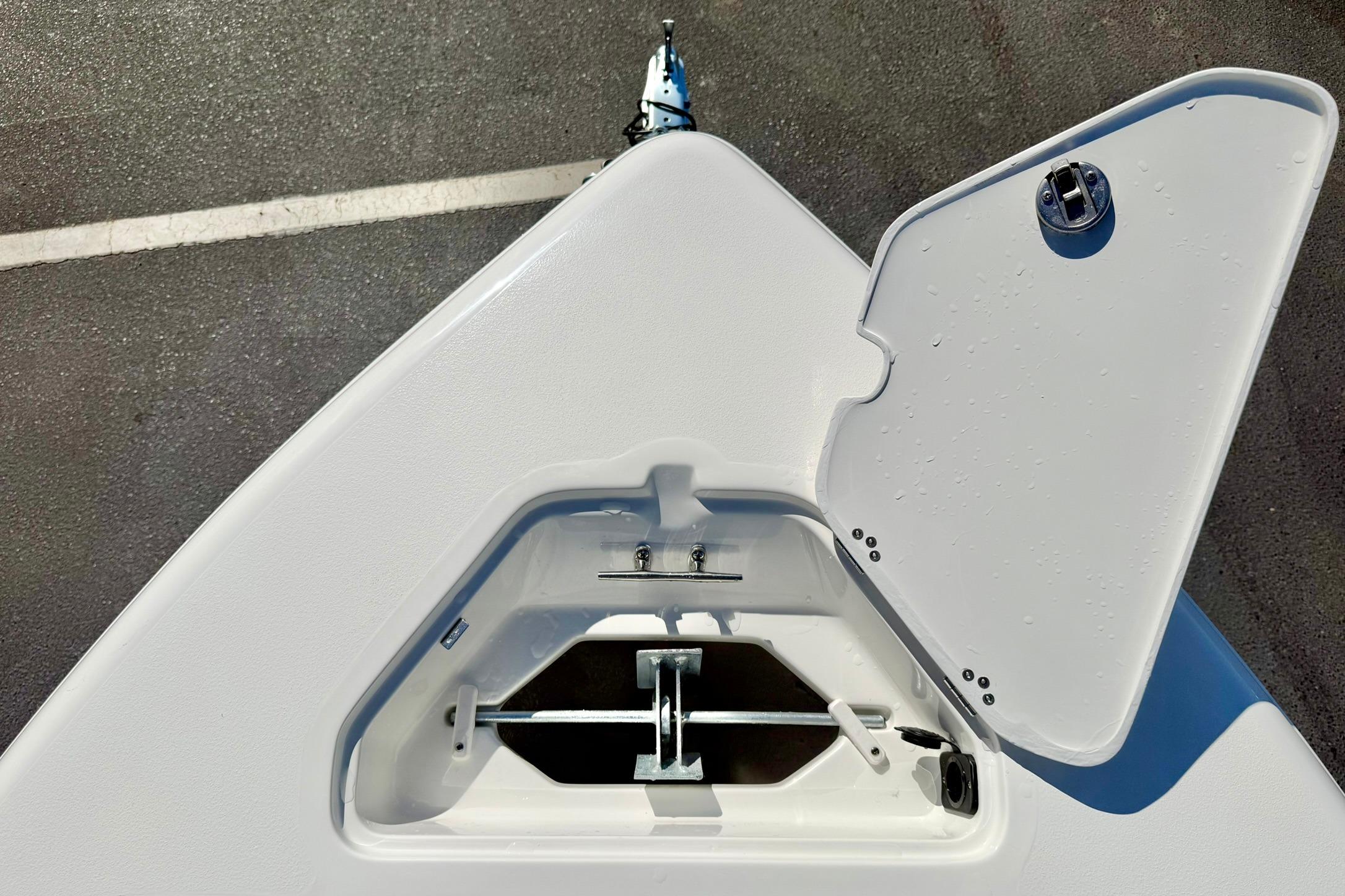 Open anchor compartment on 2026 Key West 189 FS boat, showing storage details.