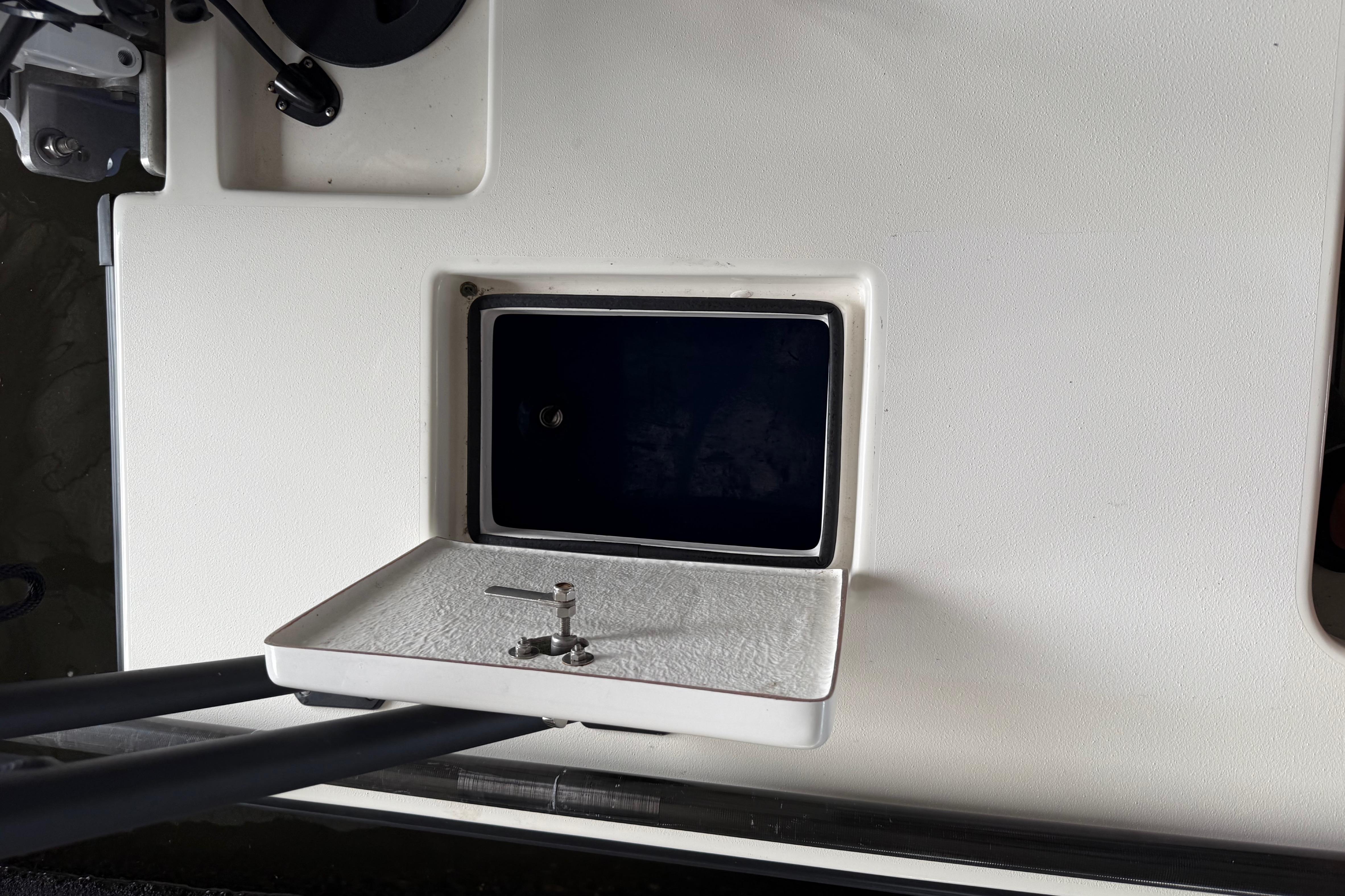 Open storage compartment on a 2020 Skimmer Skiff 14 boat deck.