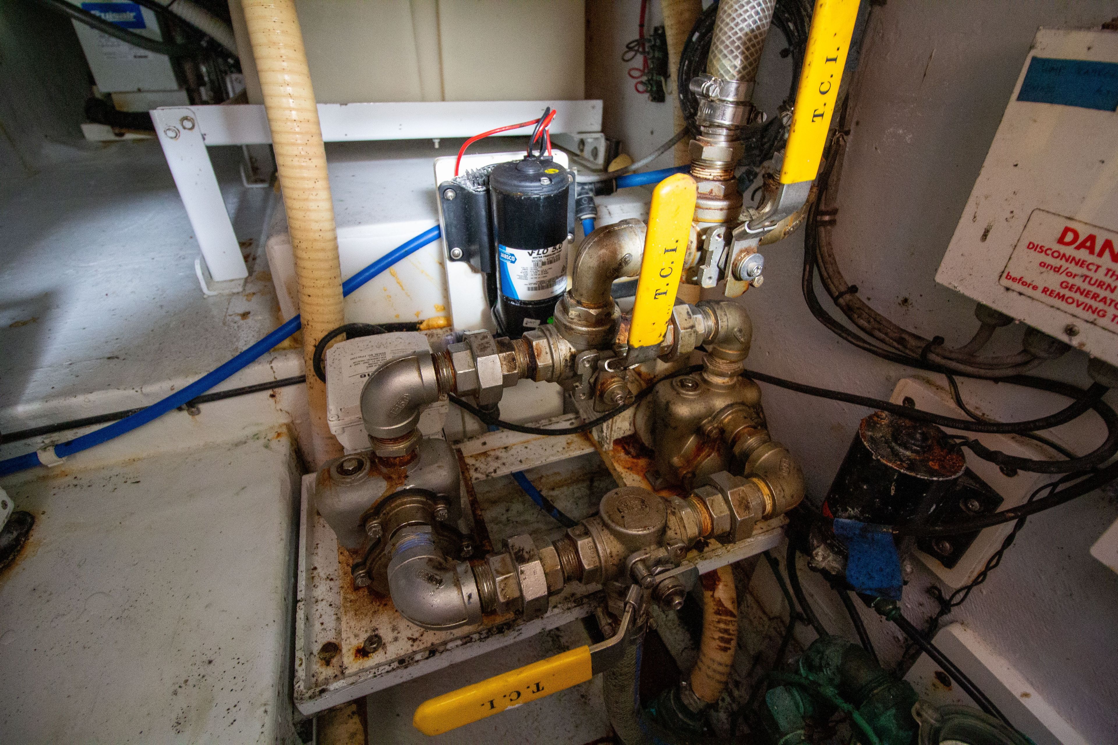 Engine room with pipes and valves, Custom 50, year 2010.