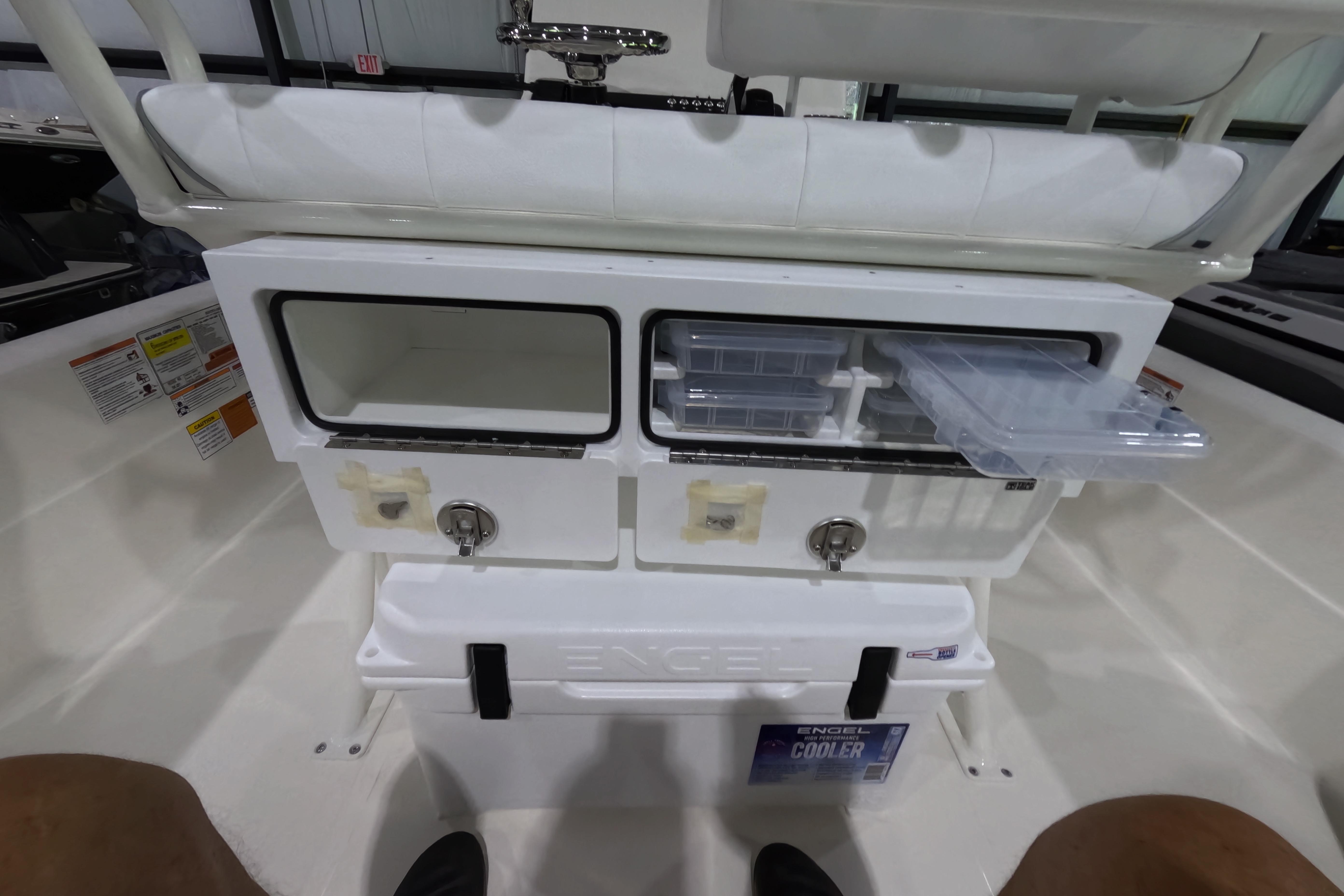 Interior of 2026 Skeeter SX221 boat with storage compartments and Engel cooler.