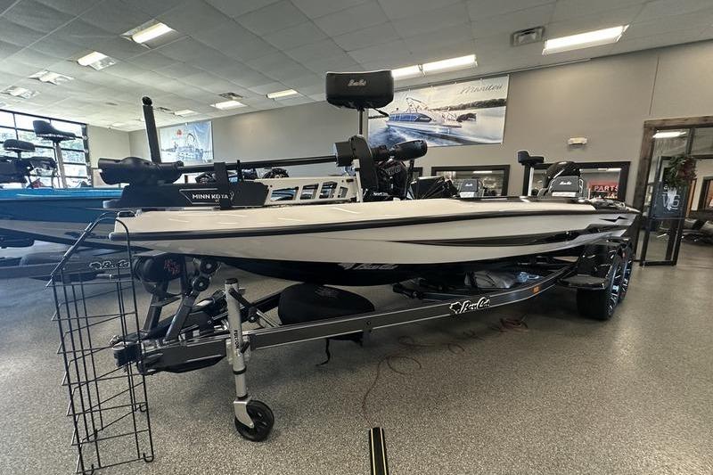 2026 Bass Cat Lynx STS boat displayed indoors on a trailer.