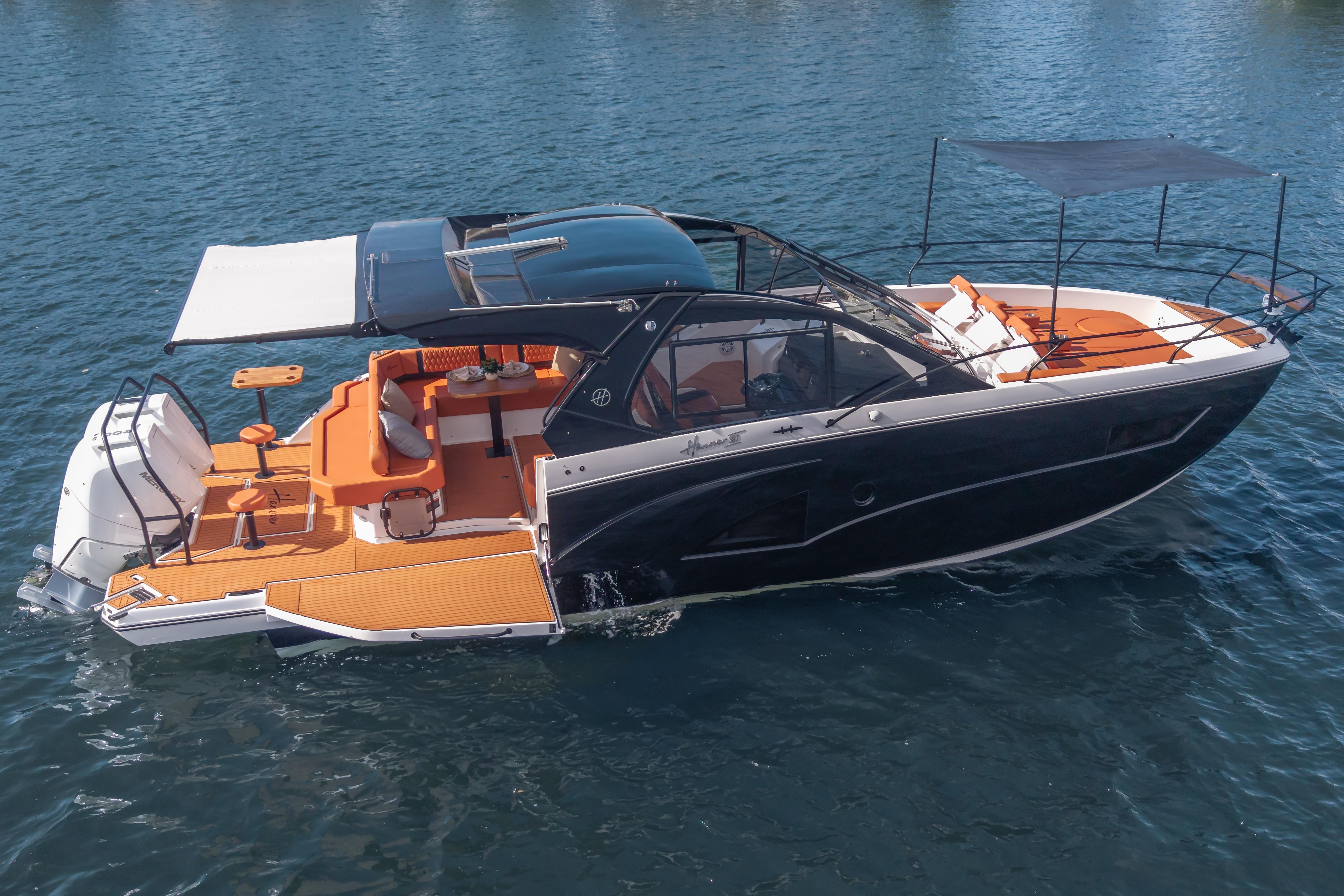Luxurious 2026 Hanover 387 yacht with sleek design and spacious deck on calm water.