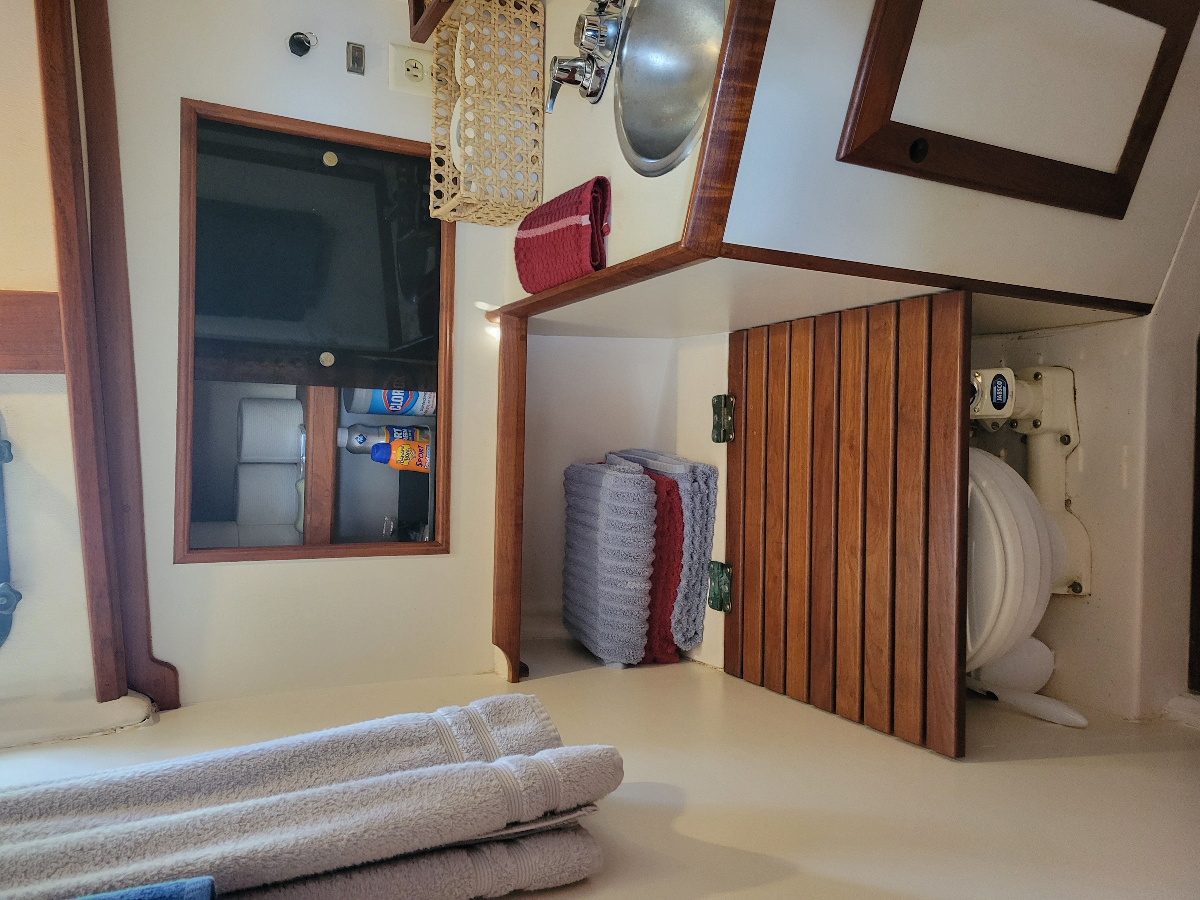 Interior of a 1989 Cape Dory MS300 with a sink and toilet.