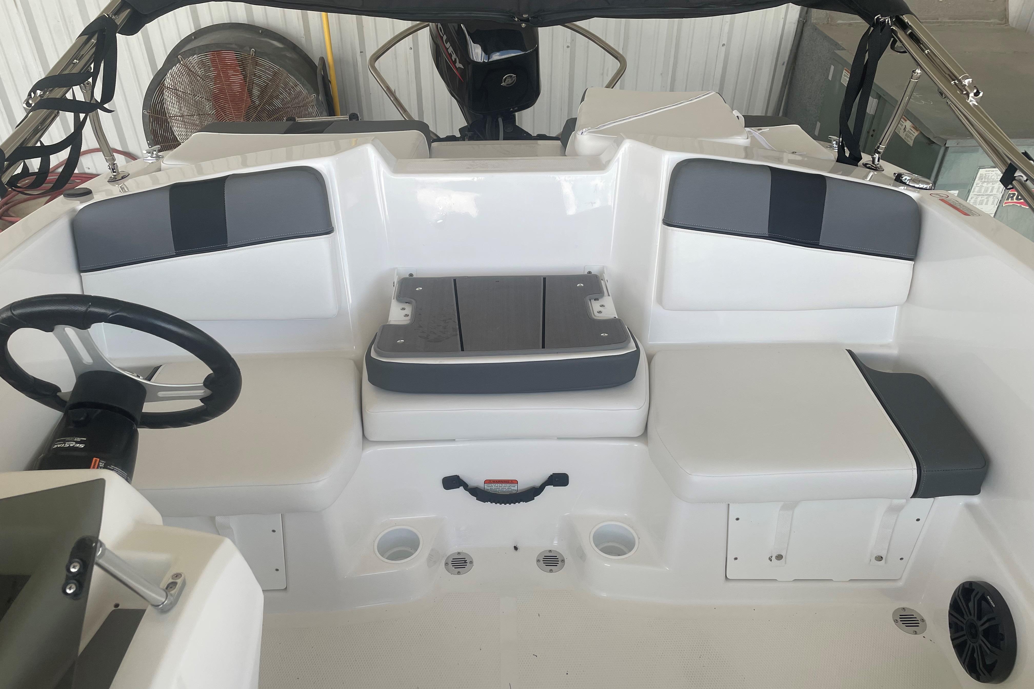 2026 Tahoe T16 boat interior with cushioned seating and steering wheel.
