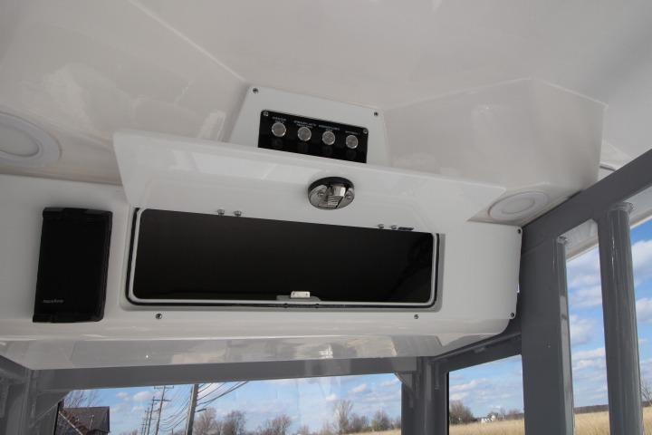 Interior view of 2026 Sea Fox 248 Commander with storage and controls.