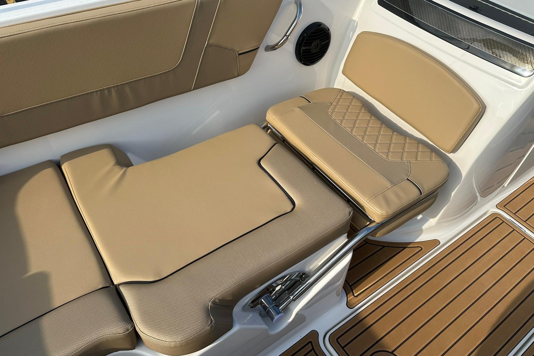2026 Bayliner VR6 Bowrider OB interior with tan seating and teak-style flooring.