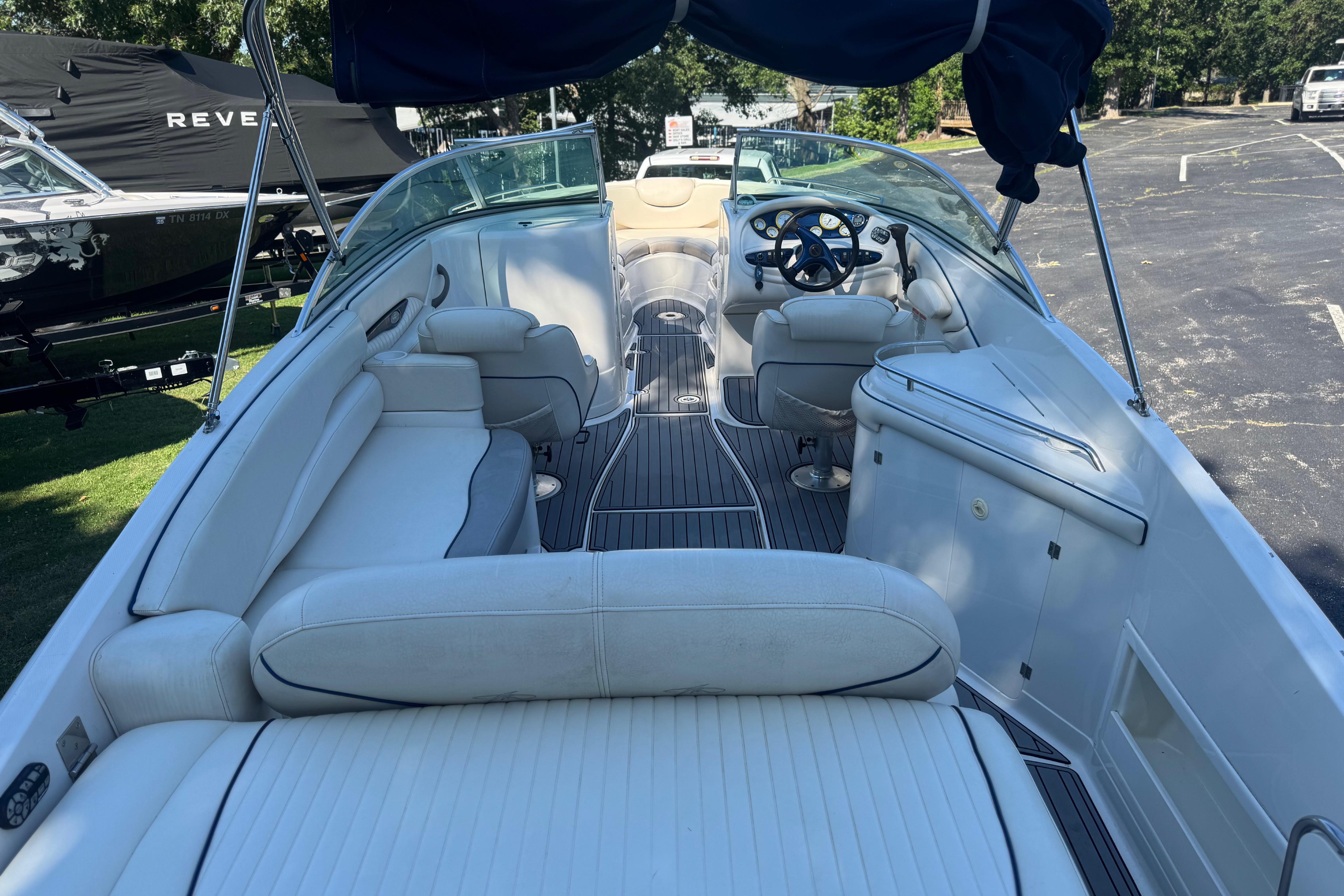 Interior view of a Monterey 268SS Super Sport boat with white seating and steering wheel.