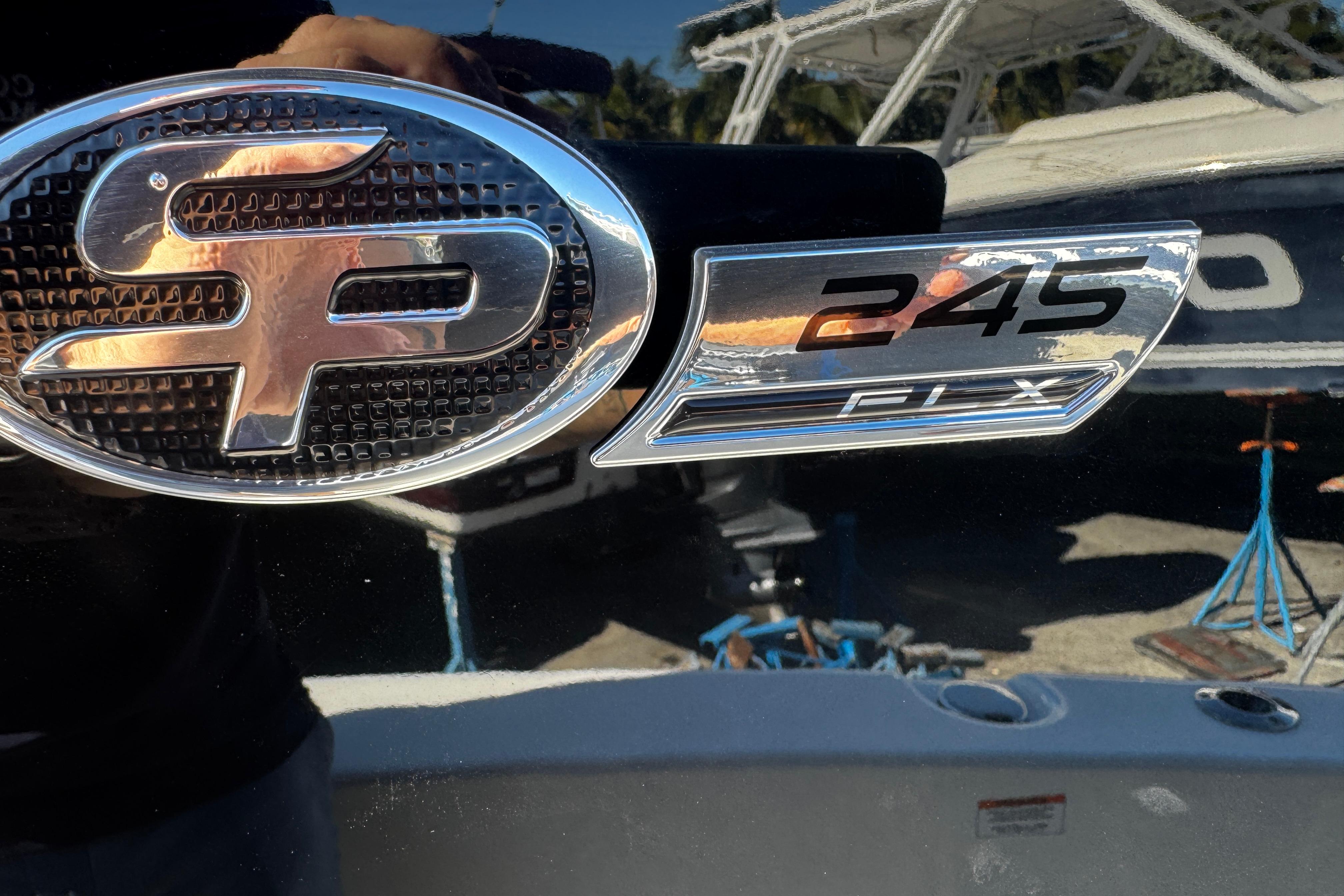 2026 Sea Pro 245FLX Sandbar boat emblem with chrome detailing.