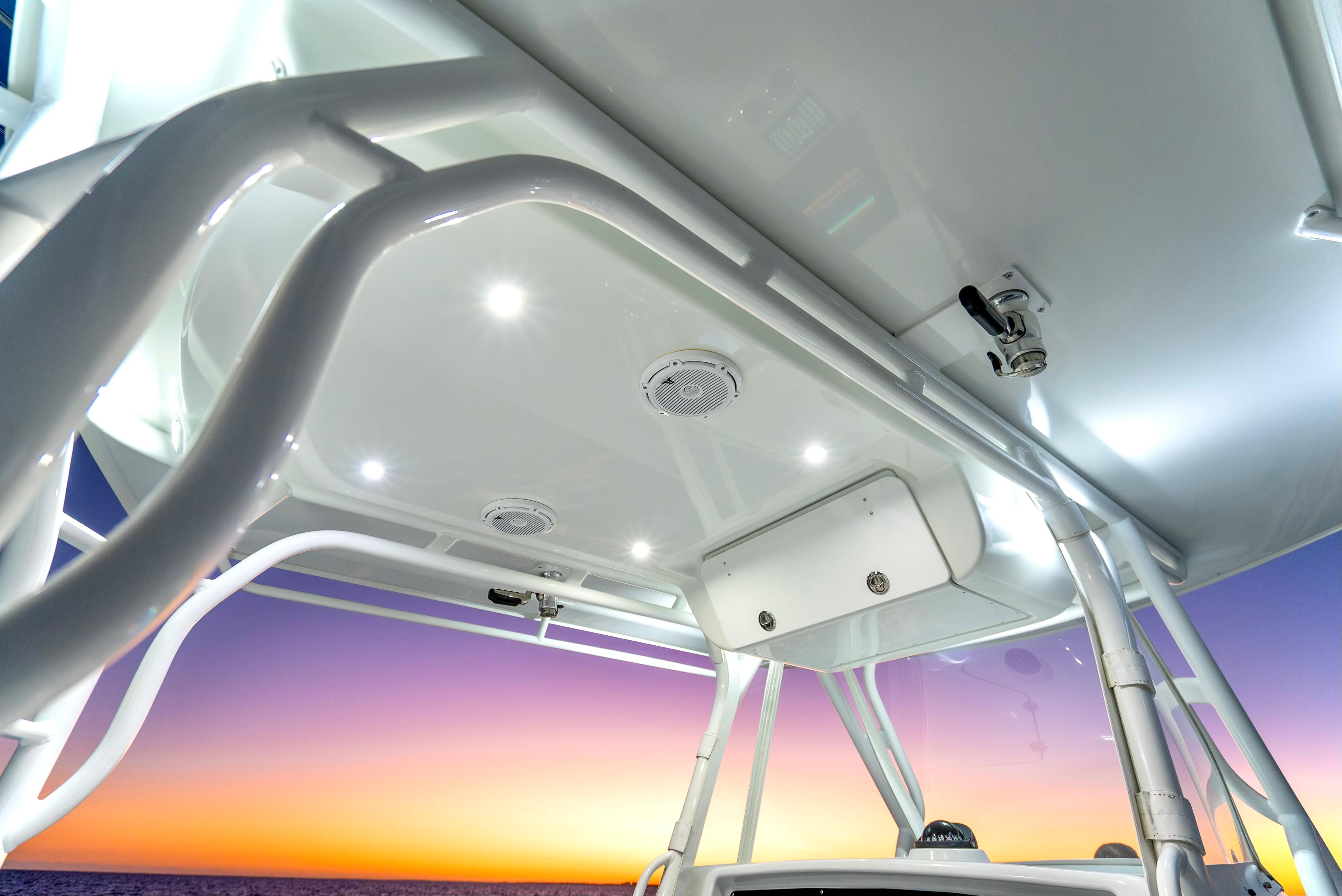 2016 Yellowfin 39 Offshore boat canopy with lights at sunset.