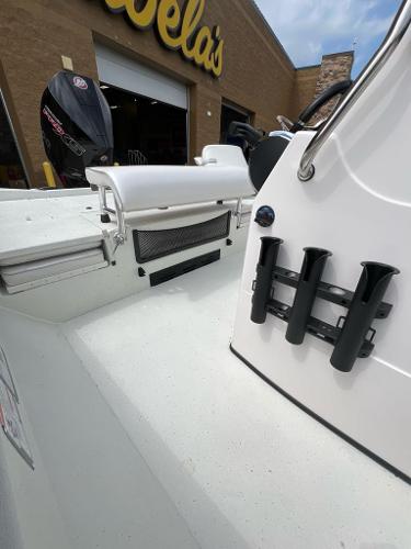 2024 Ranger RB210 boat at Cabela's, featuring rod holders and a sleek white design.
