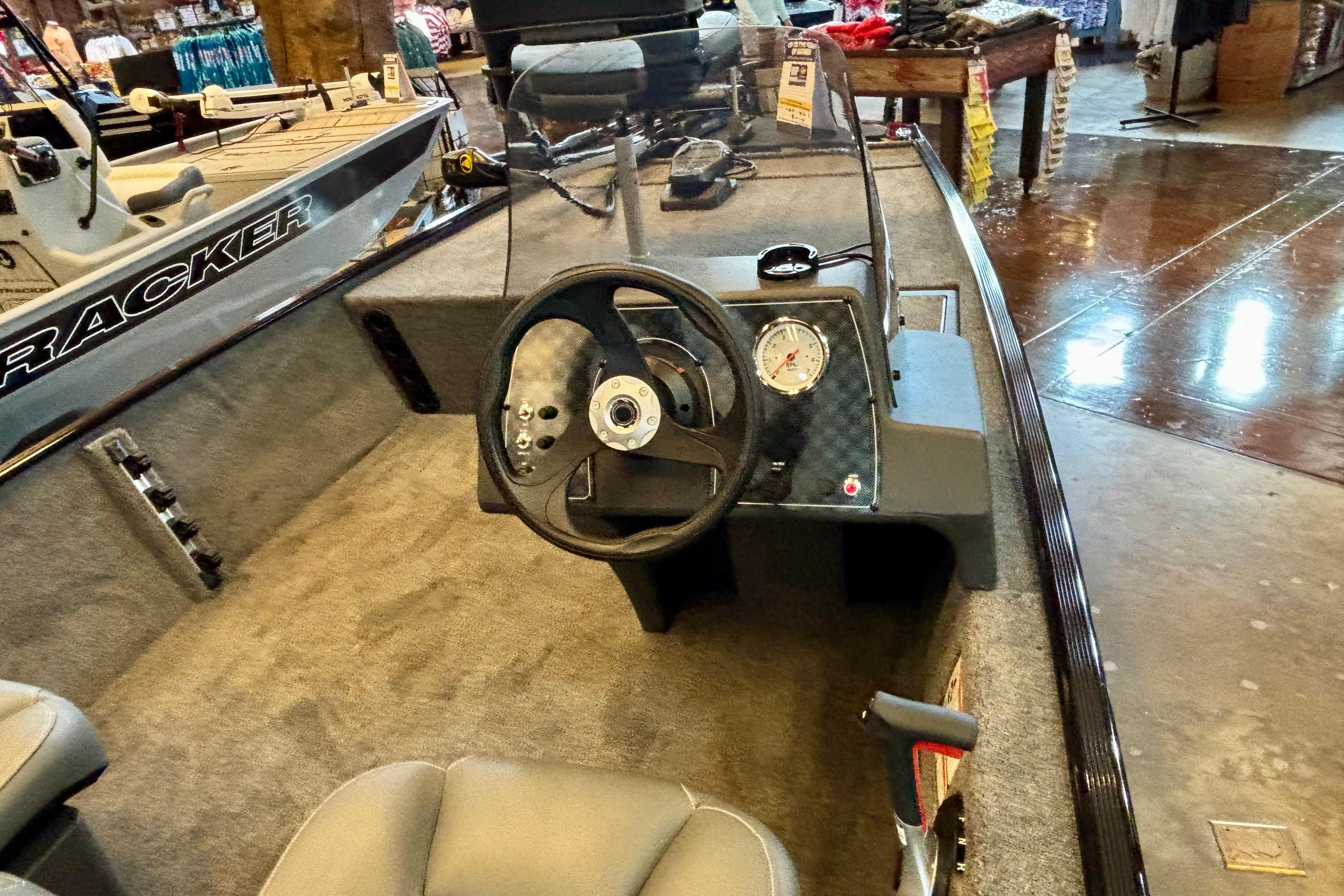 2026 Tracker Bass Tracker Classic XL boat interior with steering wheel and dashboard display.