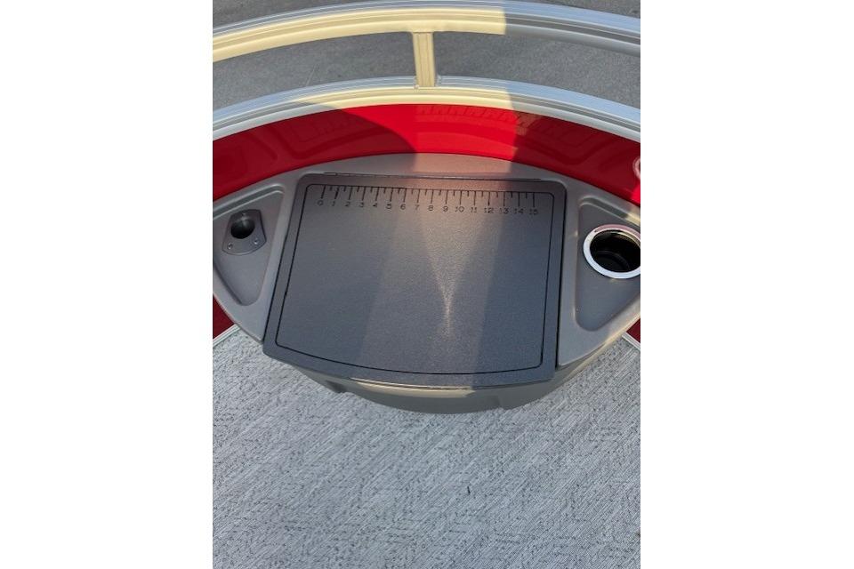 2026 Sun Tracker Fishin' Barge 22 XP3 deck with measuring board and cup holder.