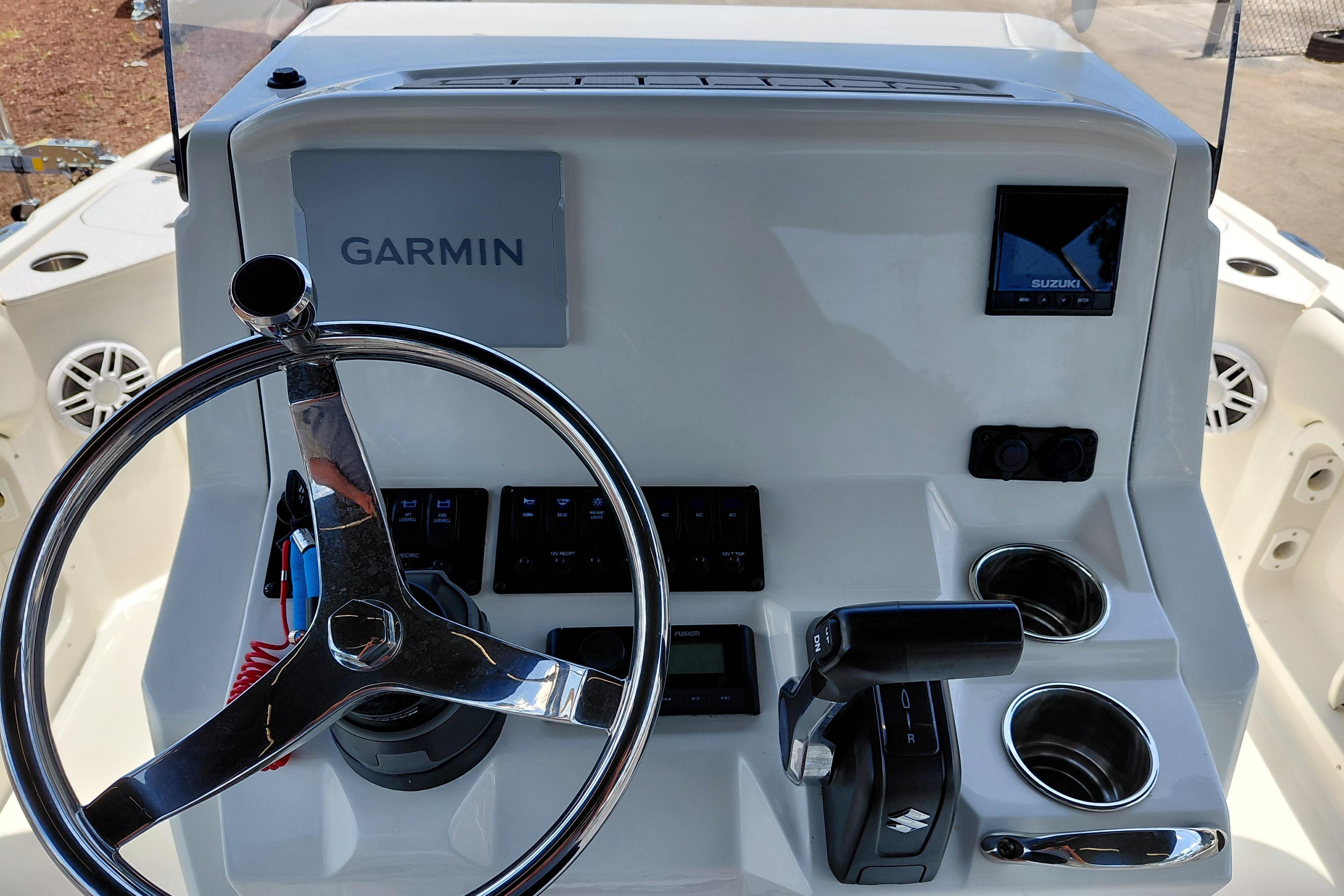 2023 Stingray 206 CC boat dashboard with Garmin navigation and Suzuki controls.
