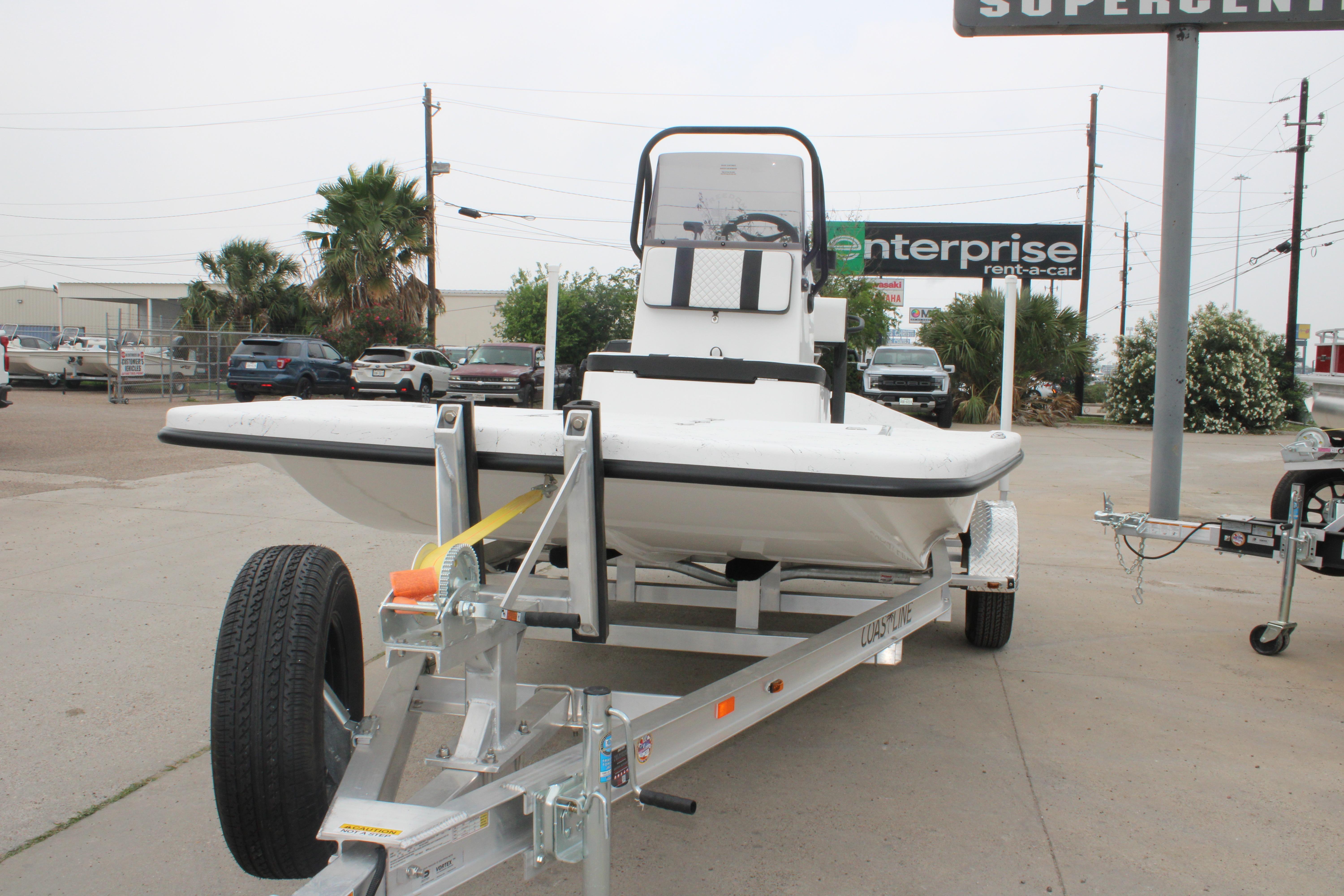 2026 Freedom Boats 16' Eagle on trailer in parking lot.