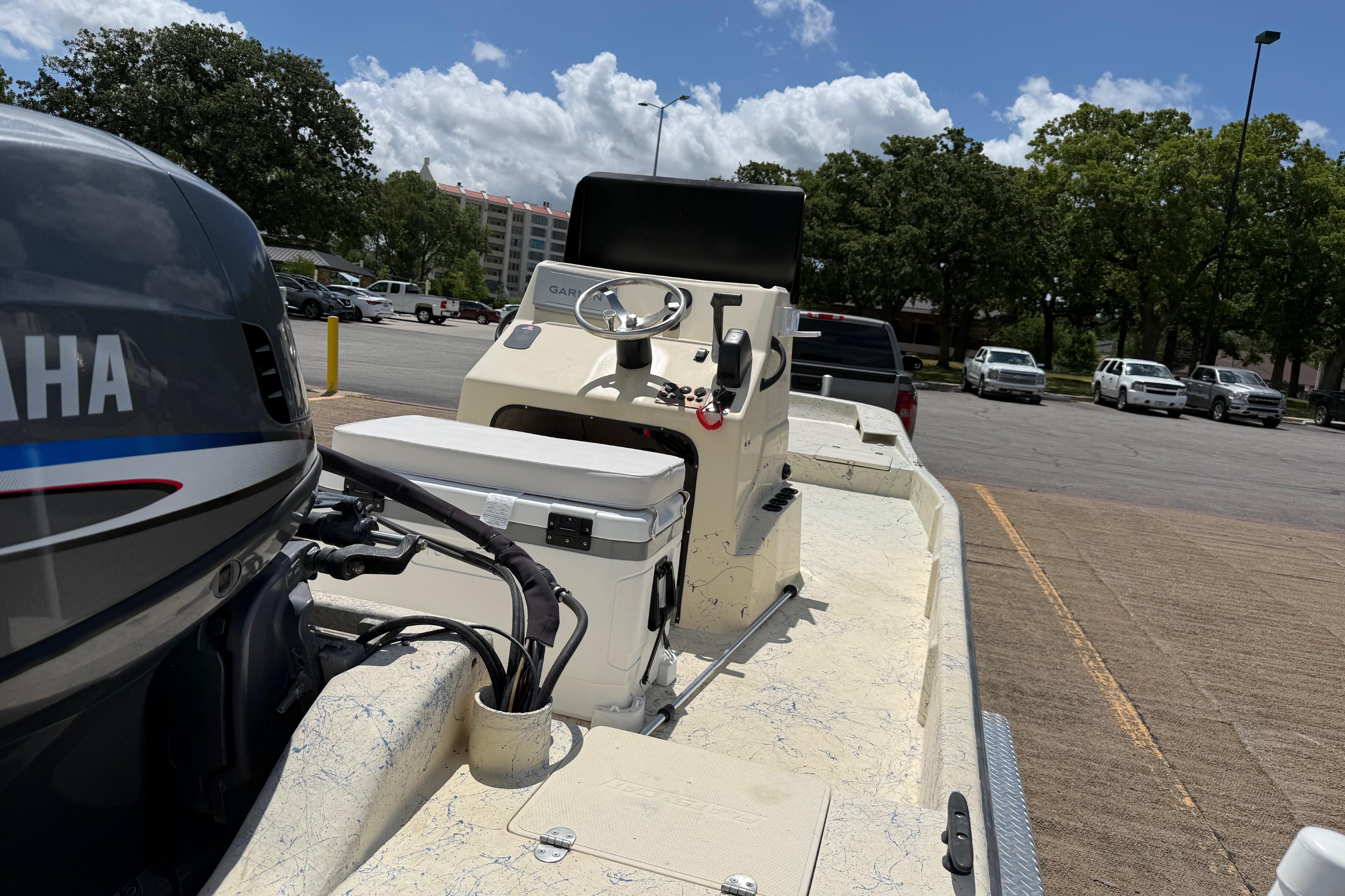2007 Flats Cat 19 boat with Yamaha engine in parking lot.