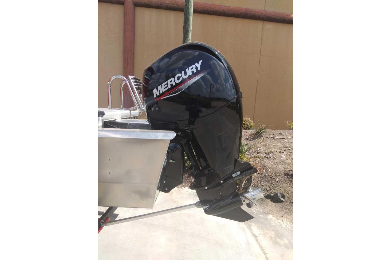 2026 Sun Tracker Party Barge 22 XP3 with Mercury outboard motor.