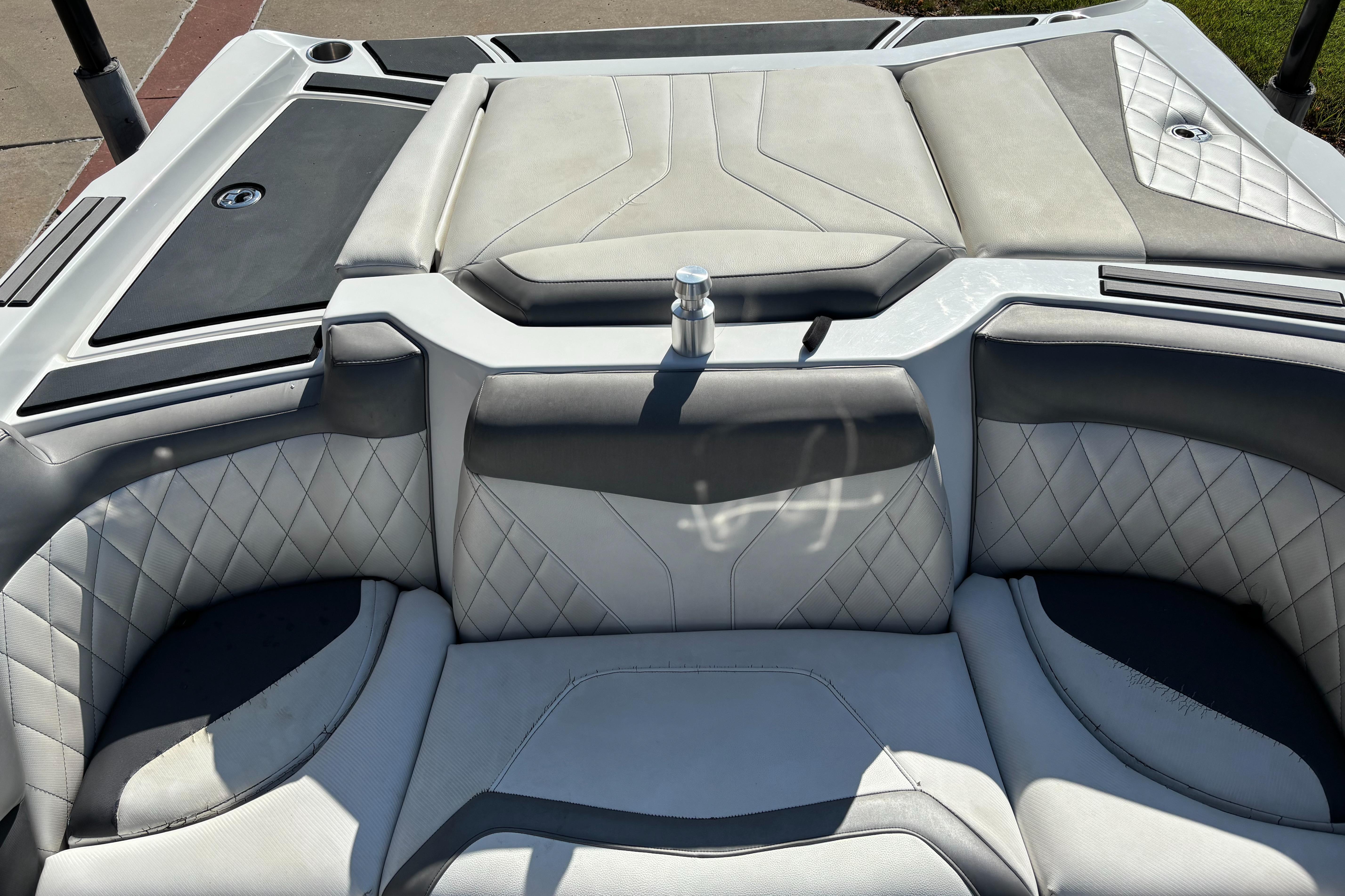 2014 Tigé RZR boat interior with quilted gray and white seating.
