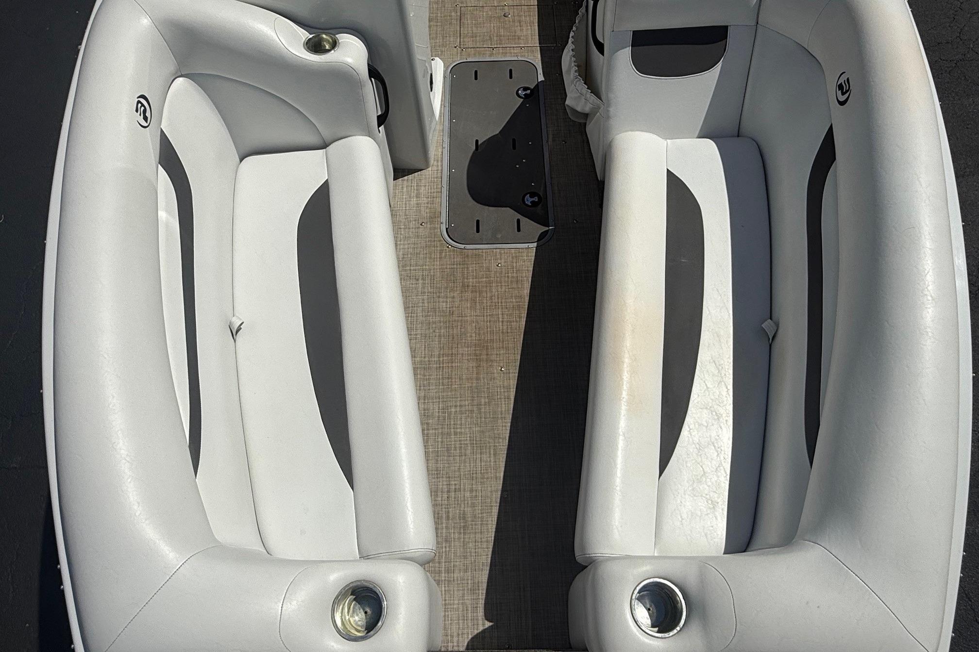 Interior seating of a 2019 Princecraft Ventura 190 boat, featuring gray cushioned benches.