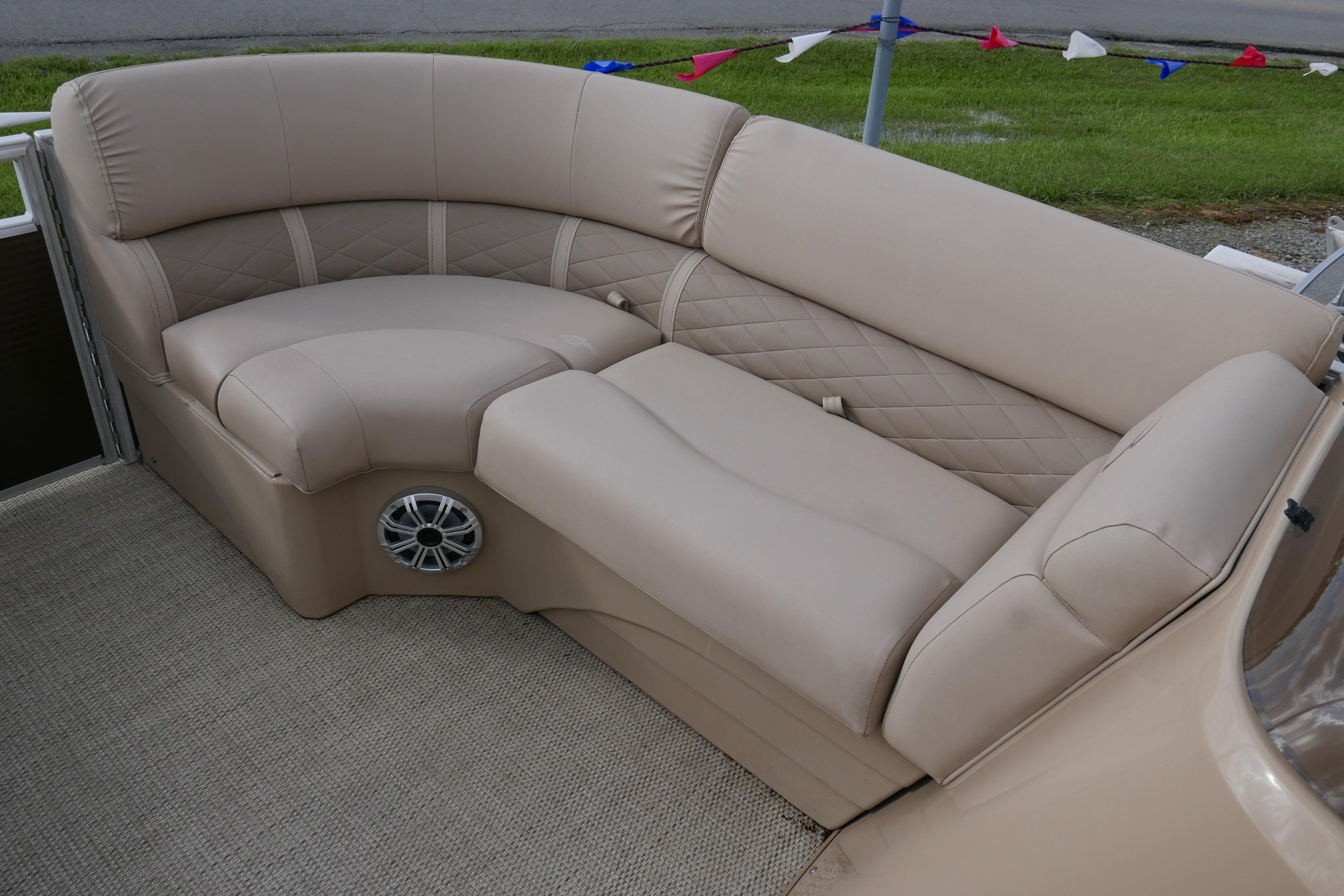 2018 Bennington 22 SSRX pontoon boat with beige seating and speaker detail.