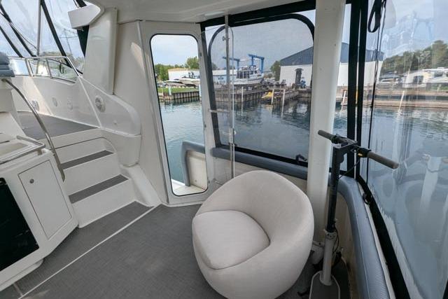 1998 Silverton 402 Motor Yacht interior with modern seating and marina view.