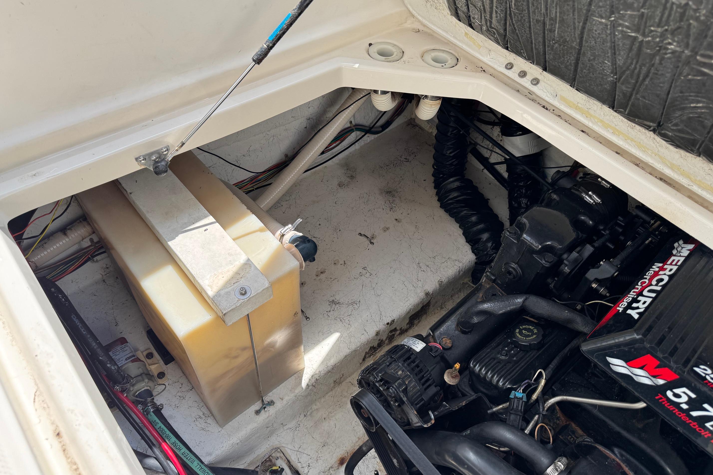 Engine compartment of a 2000 Maxum 2400 SCR boat with Mercury MerCruiser engine.