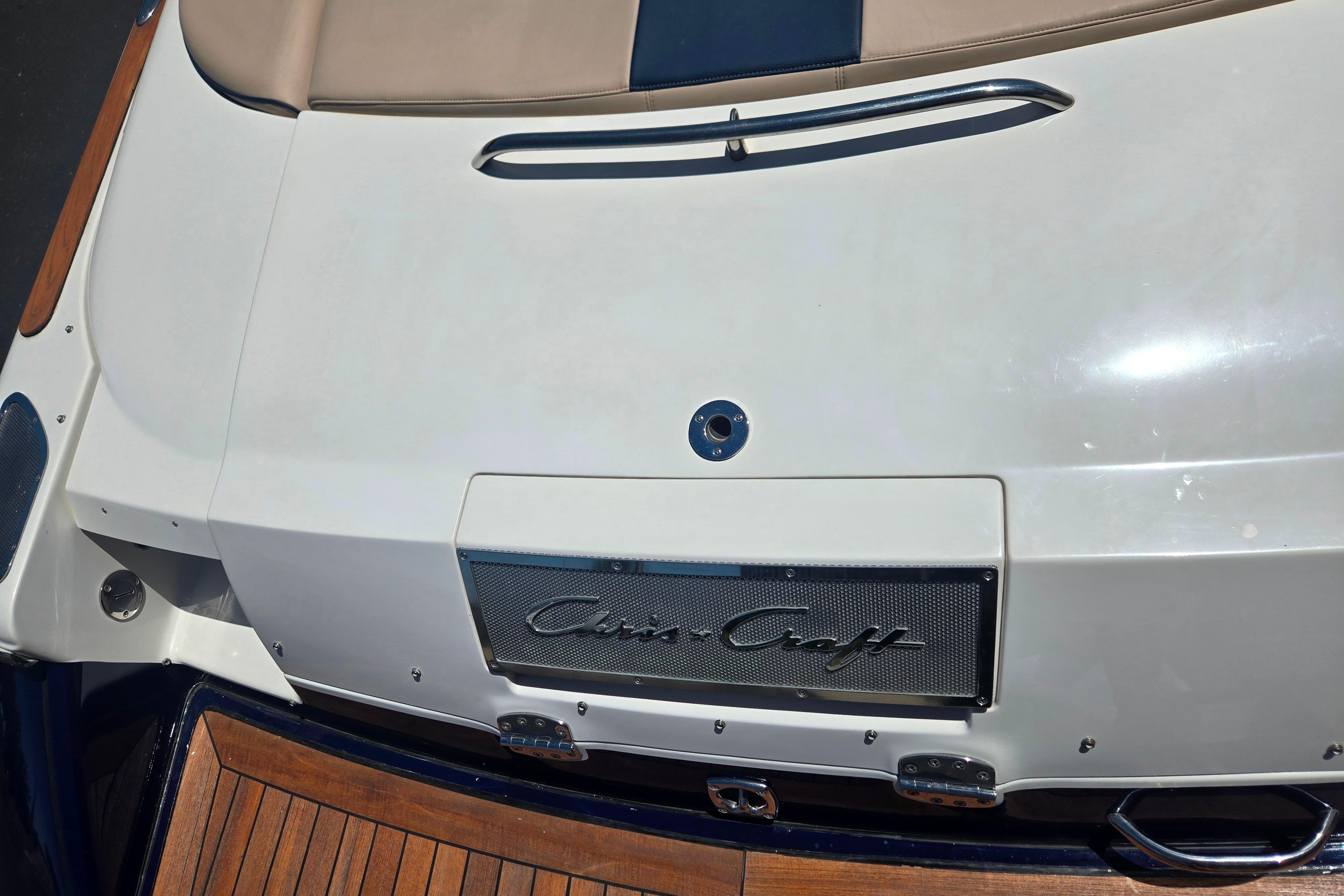 Rear view of 2002 Chris-Craft Launch 28 GT I/O boat with teak deck and logo.