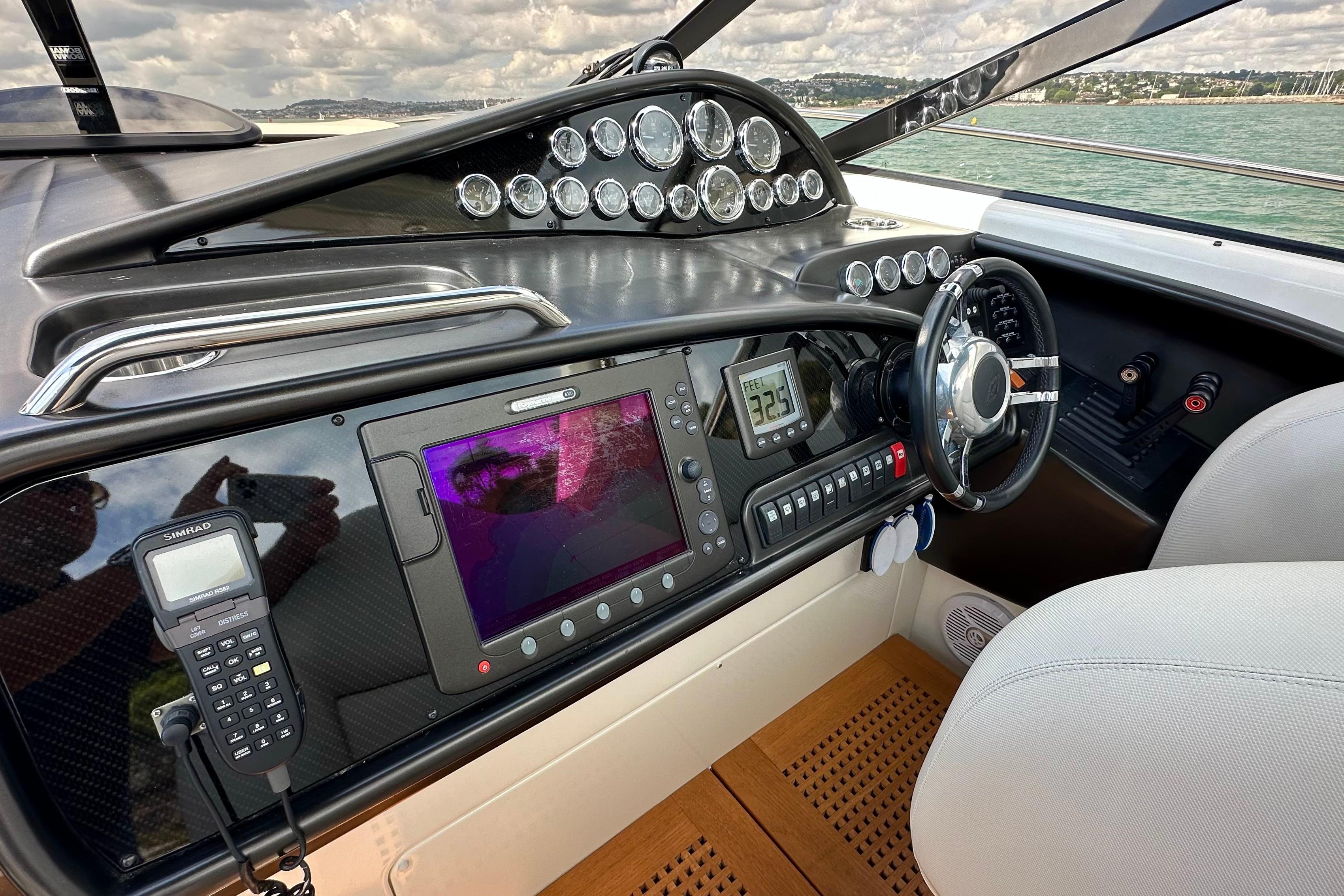 Cockpit of 2008 Sunseeker Superhawk 43 with advanced navigation controls and steering wheel.