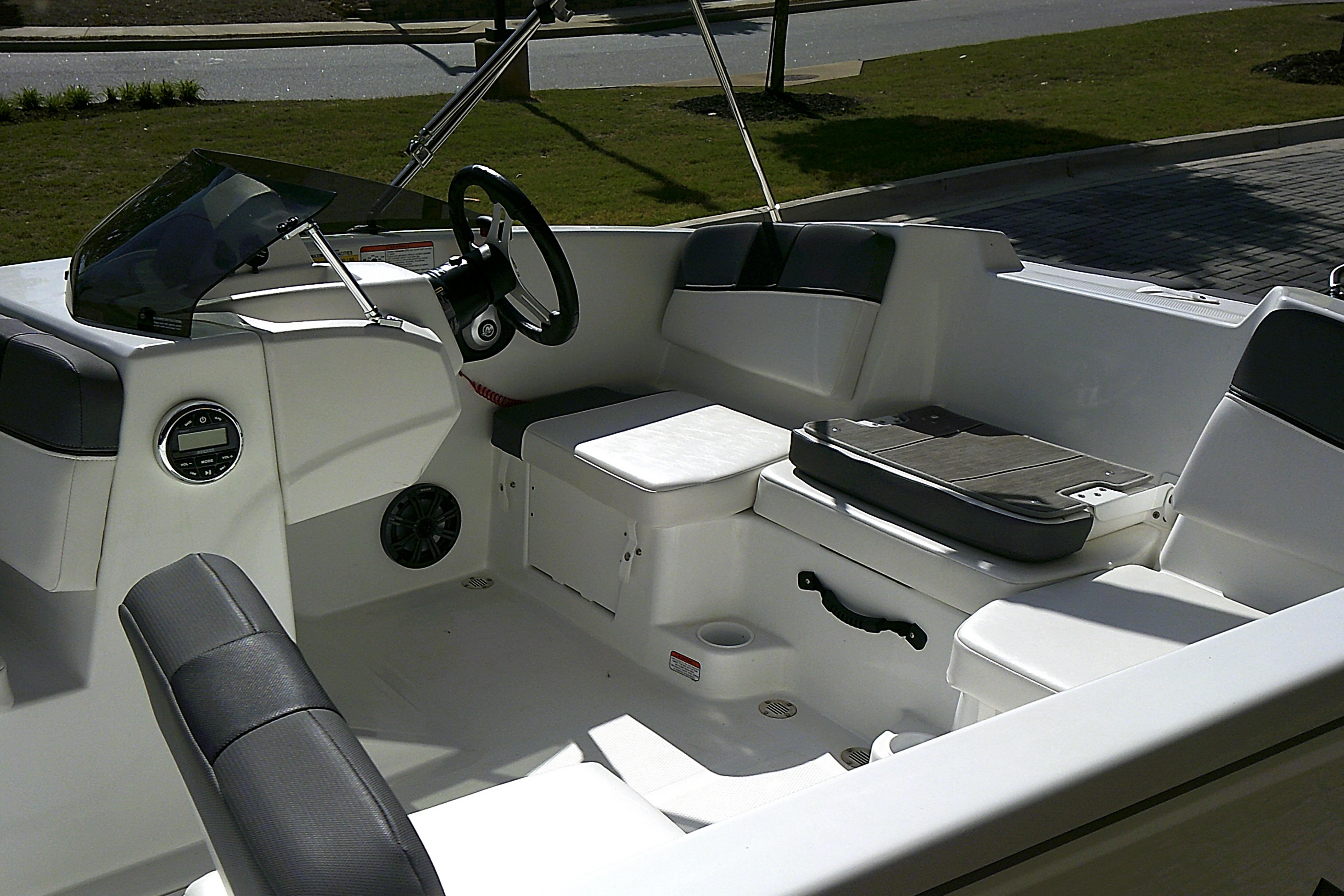 2025 Tahoe T16 boat interior with modern seating and steering wheel.