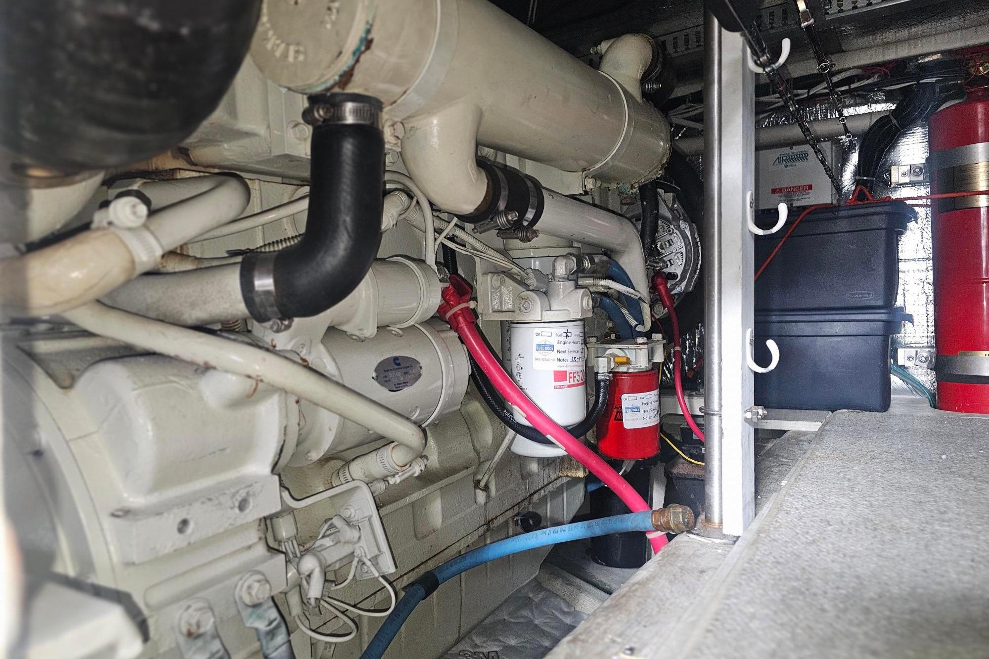 Engine room of 2002 Carver 450 Voyager Pilothouse with visible components and wiring.