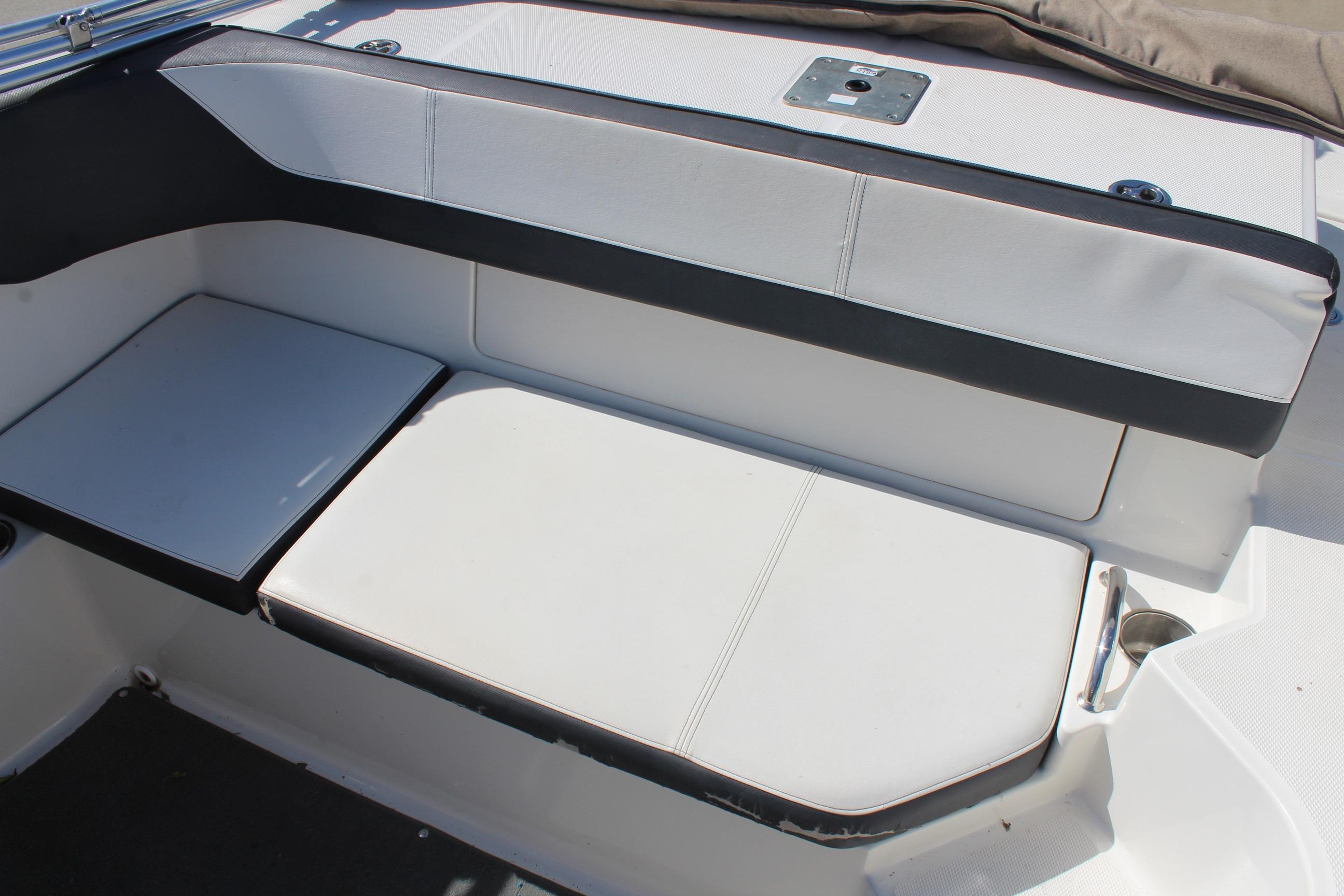 2015 Sea Ray 19 SPX OB boat interior seating with white and black upholstery.