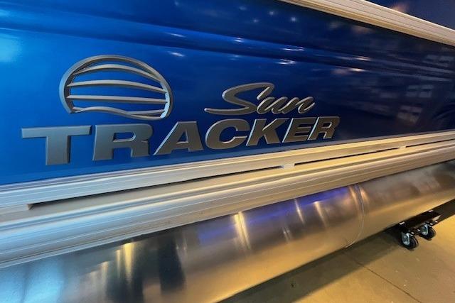 2026 Sun Tracker Fishin' Barge 20 DLX, blue exterior, close-up view.