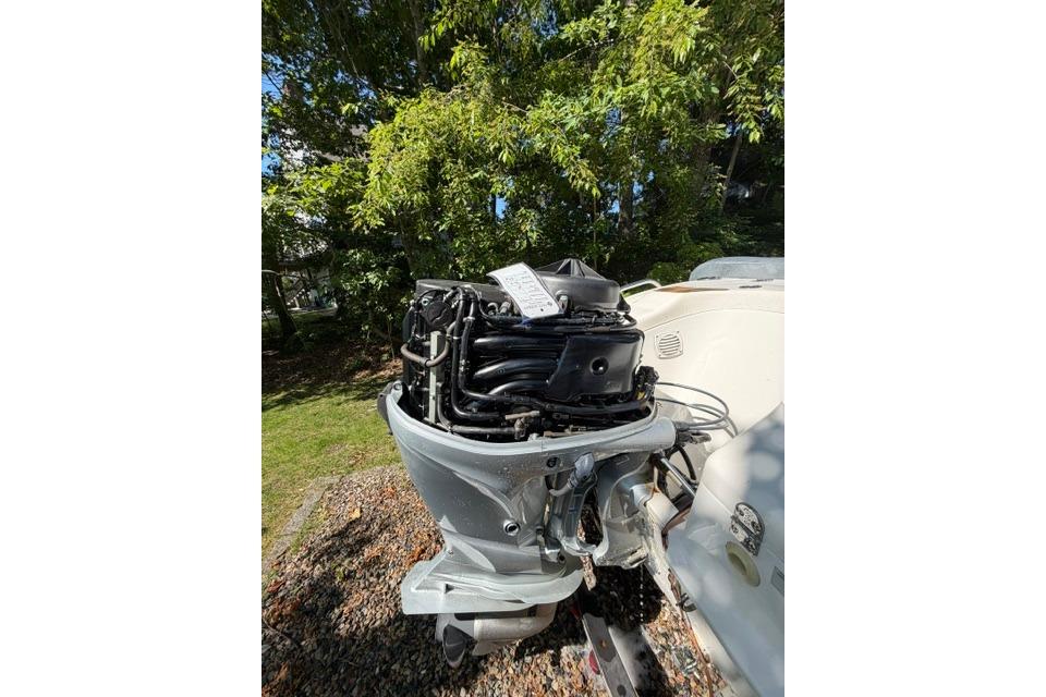 2016 Walker Bay Generation 450 DLX outboard motor in a sunny outdoor setting.