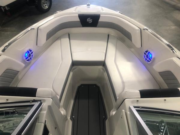 2023 Chaparral 21 Surf boat interior with LED lights and cushioned seating.